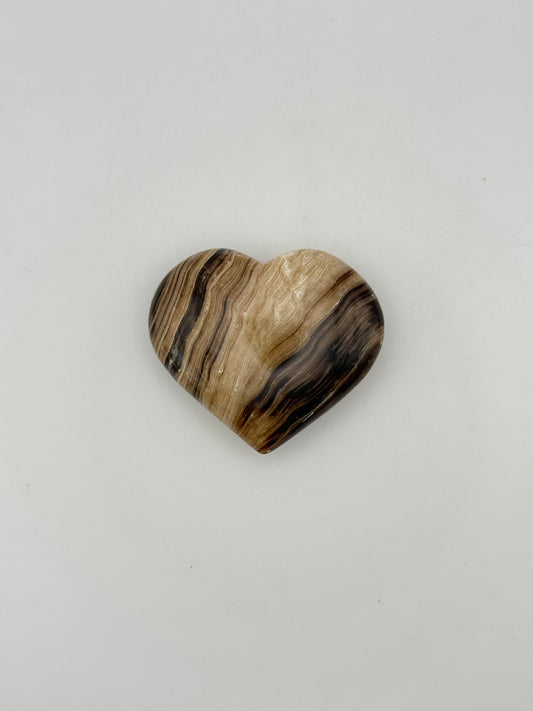 Polished chocolate calcite heart shaped crystal.