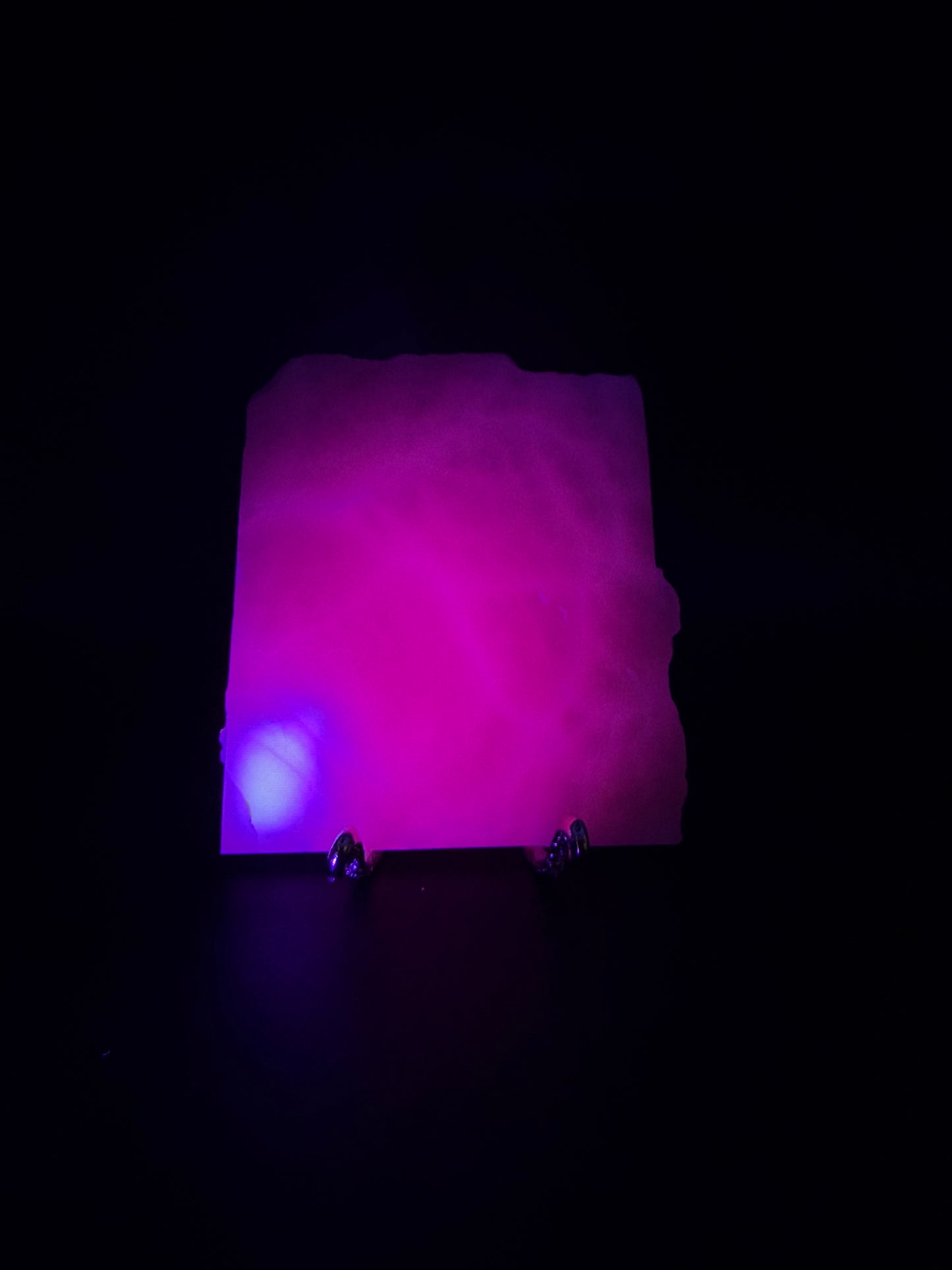 Polished pink calcite slab. Pink calcite glows under uv light.