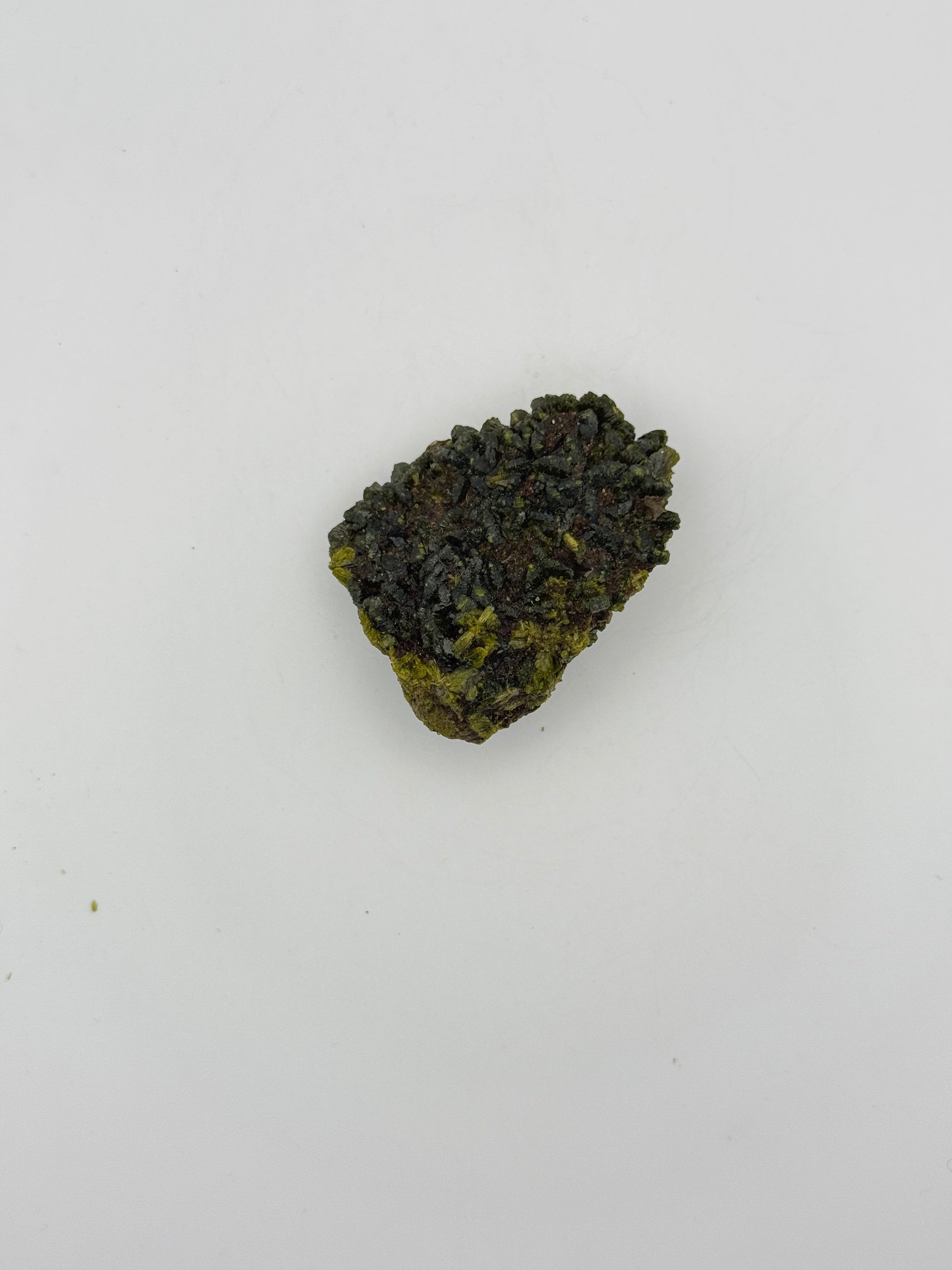 Epidote crystal cluster with good green color.