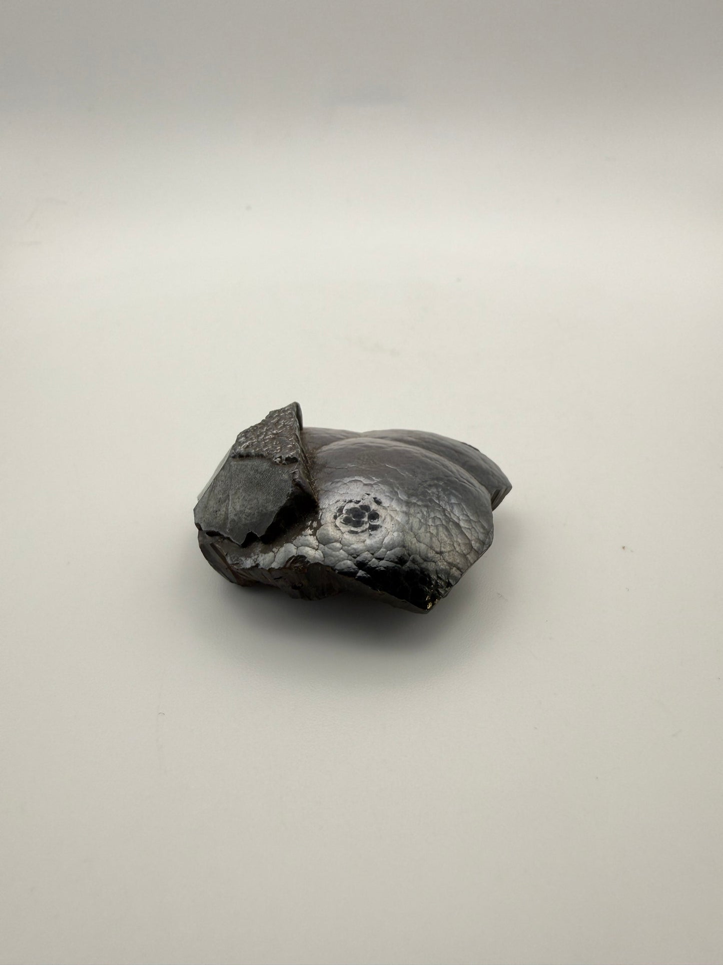 Small raw hematite specimen.