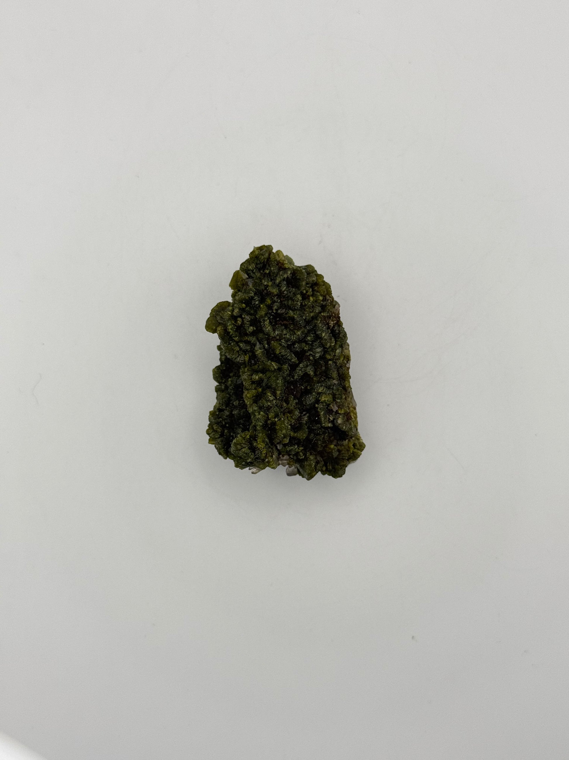 Epidote crystal cluster with good green color.
