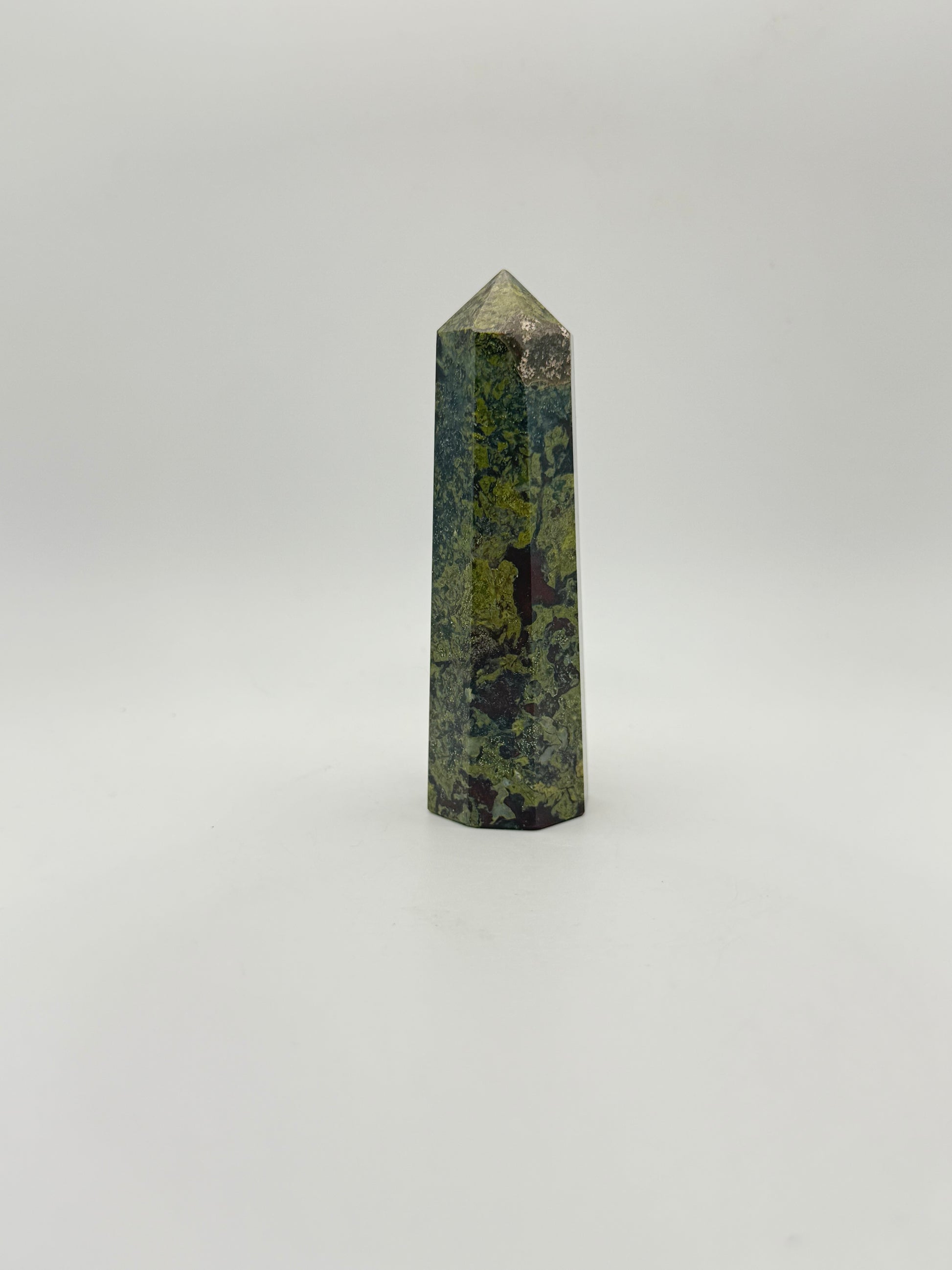 Polished Dragon Bloodstone in the shape of a tower.