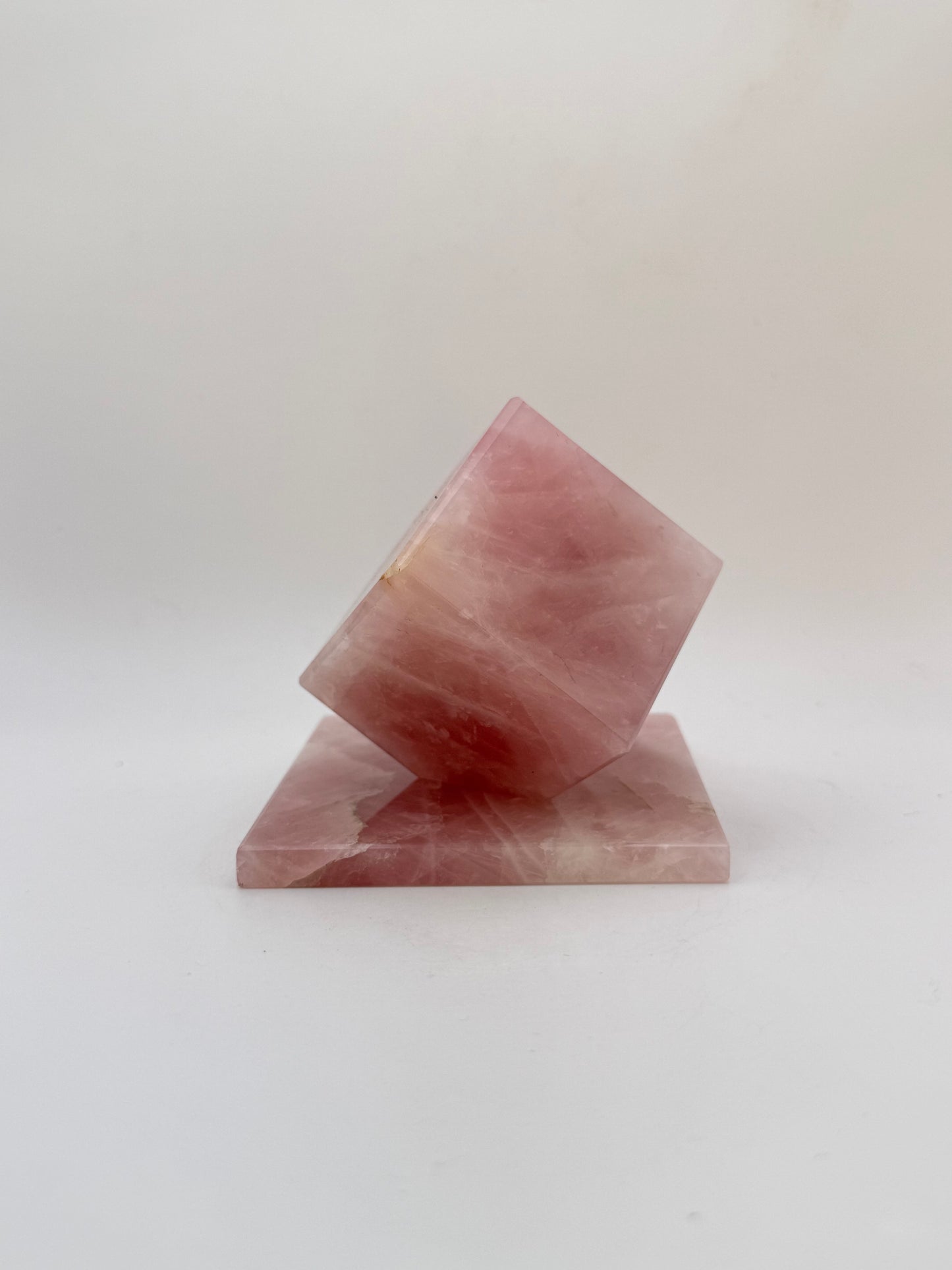 Polished rose quartz cut cube.