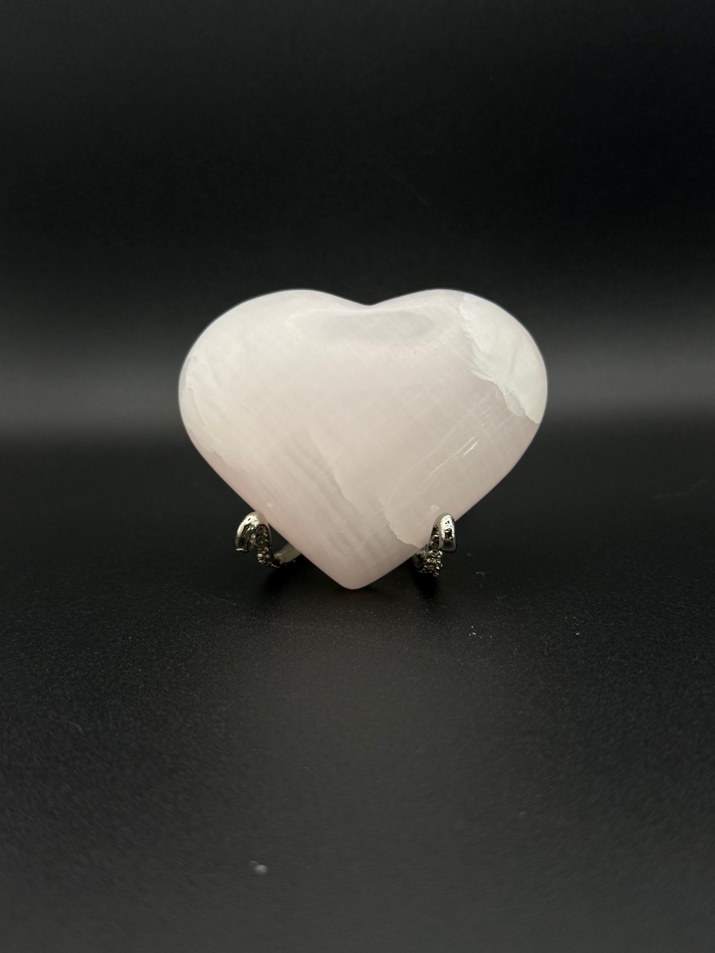 Polished Pink Calcite heart. Pink calcite is uv reactive.