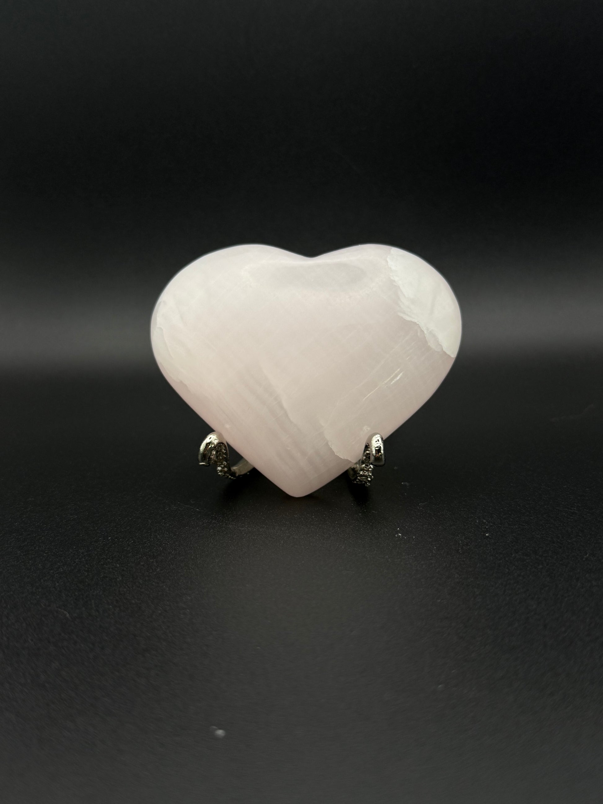 Polished Pink Calcite heart. Pink calcite is uv reactive.
