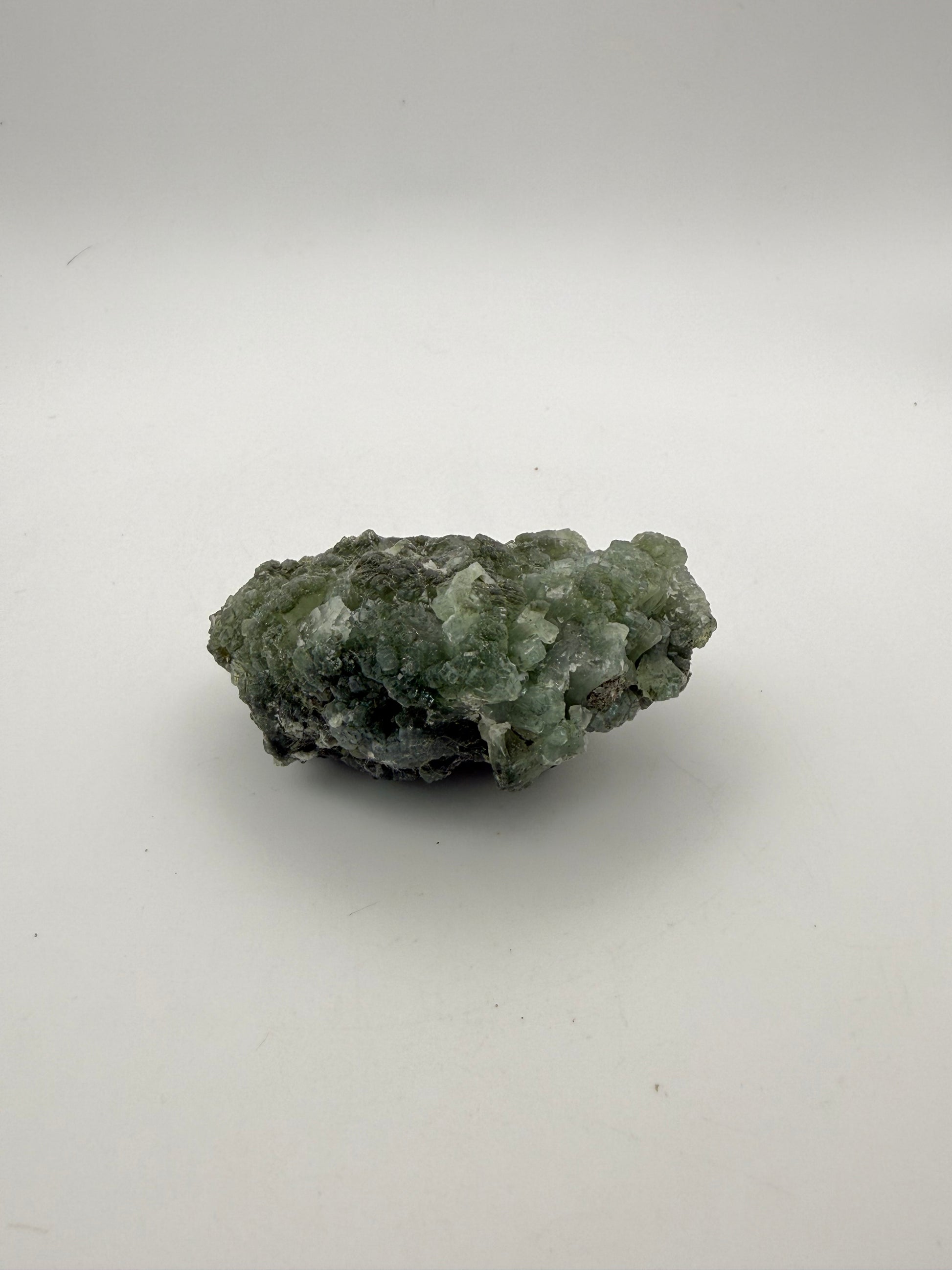 Raw Prehnite specimen with amazing green color.
