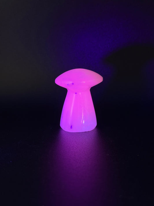 Polished pink calcite mushroom. Pink calcite glows under uv light.