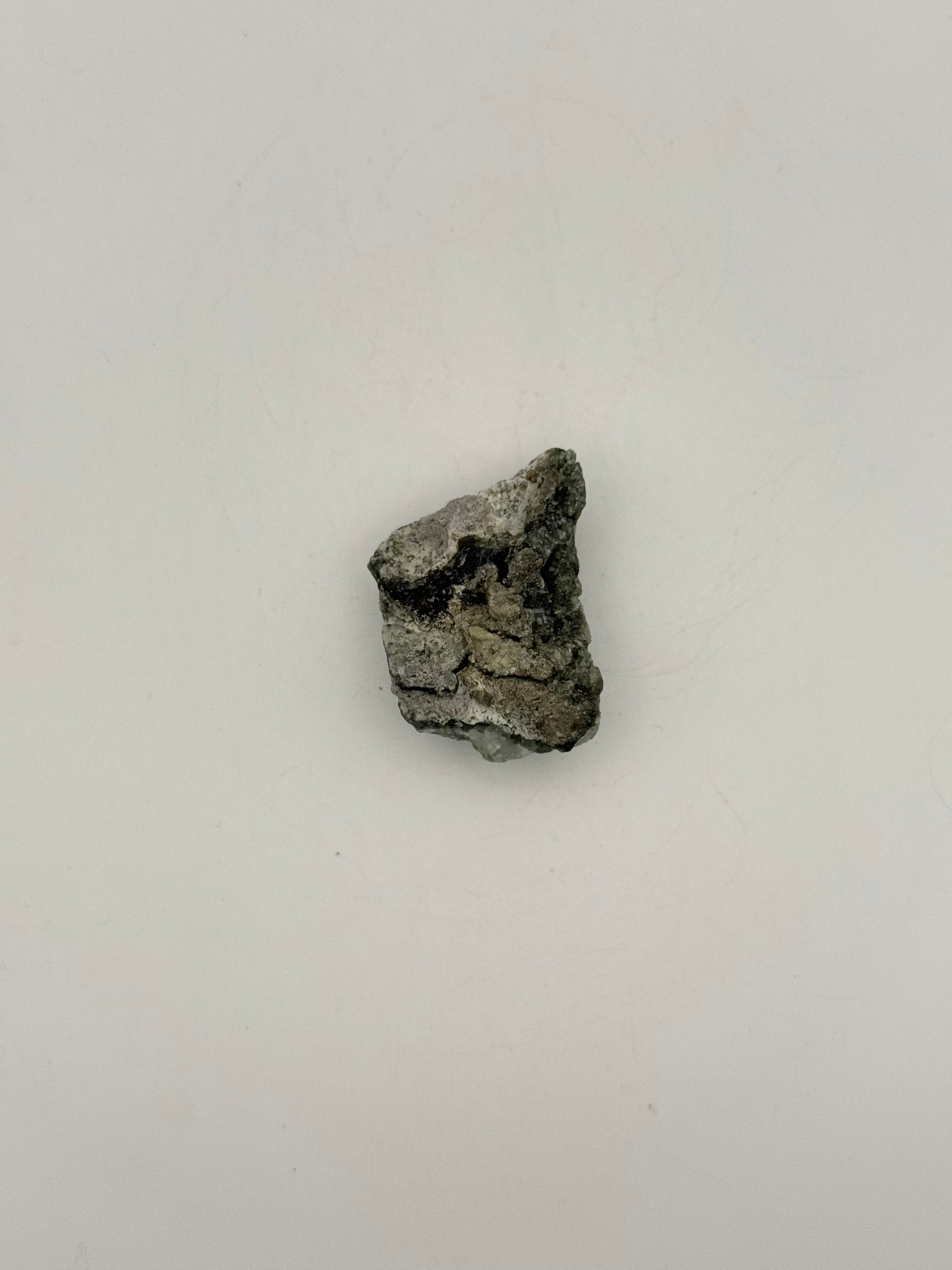 Raw prehnite specimen with amazing green color.