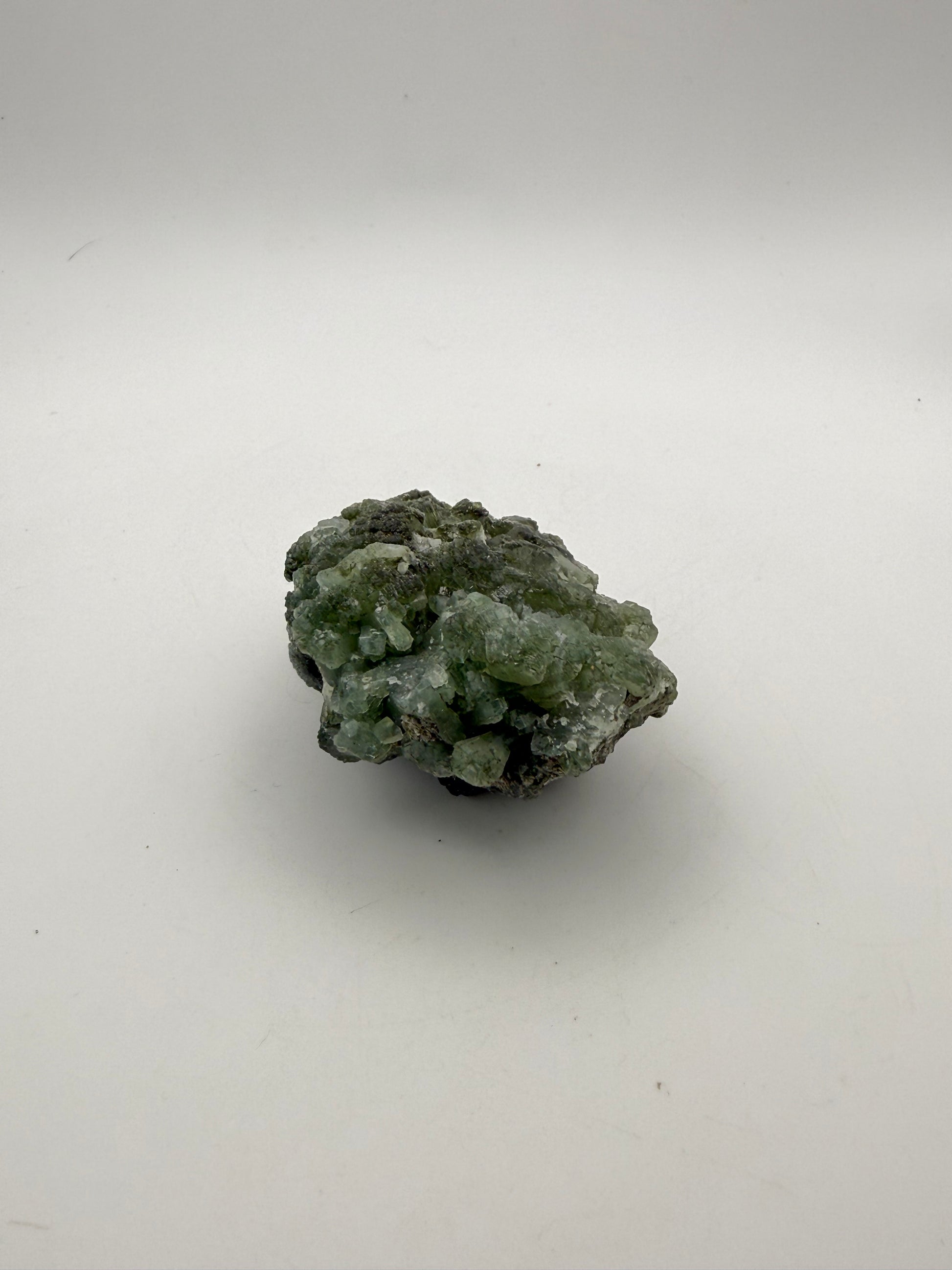 Raw Prehnite specimen with amazing green color.