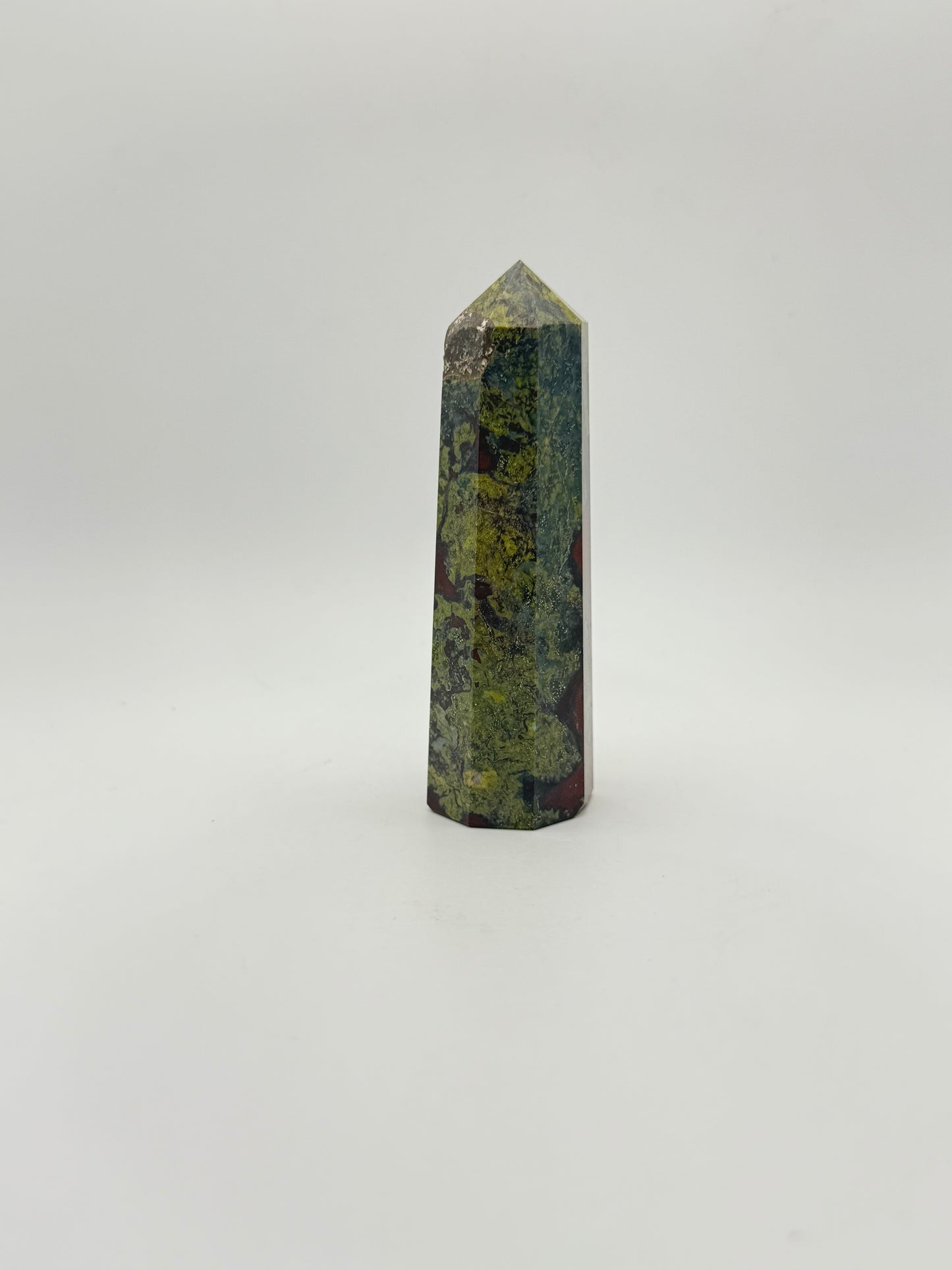 Polished Dragon Bloodstone in the shape of a tower.