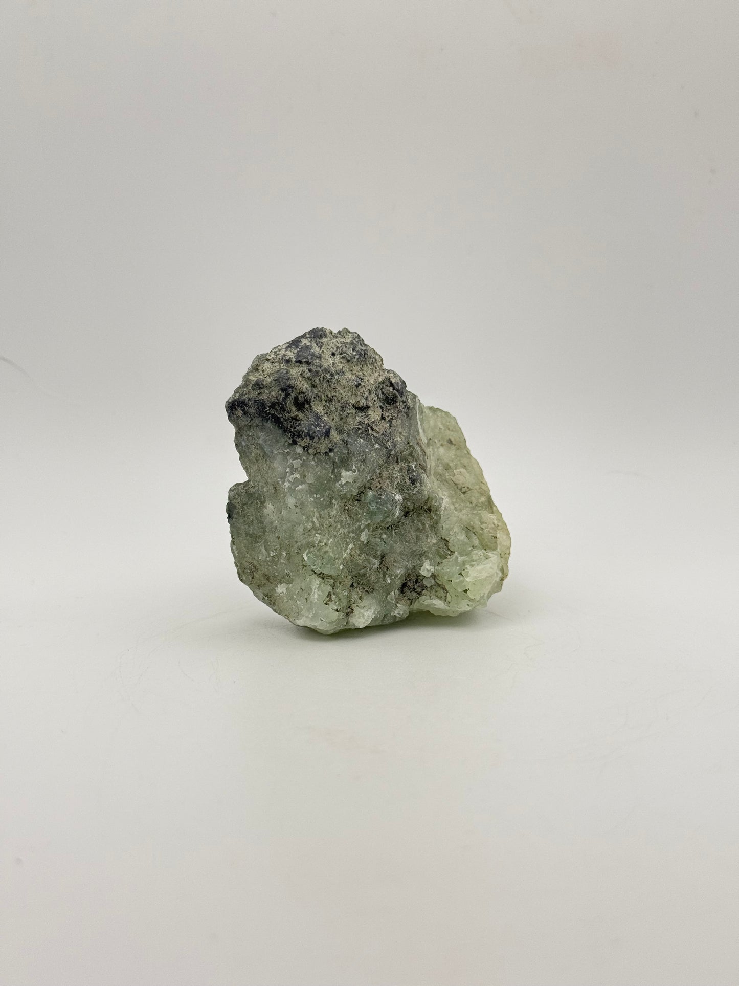 Raw Prehnite specimen with amazing green color.