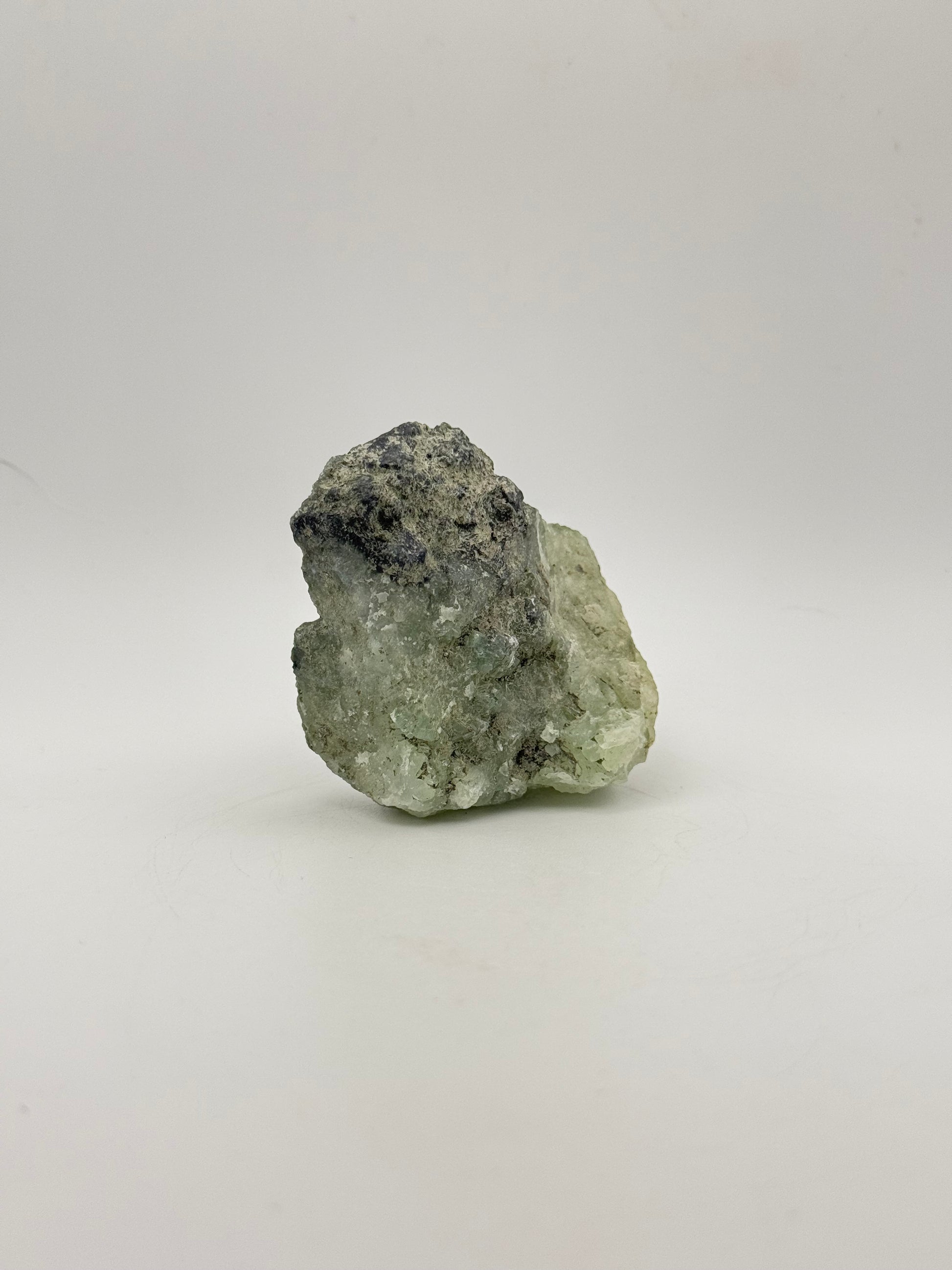 Raw Prehnite specimen with amazing green color.