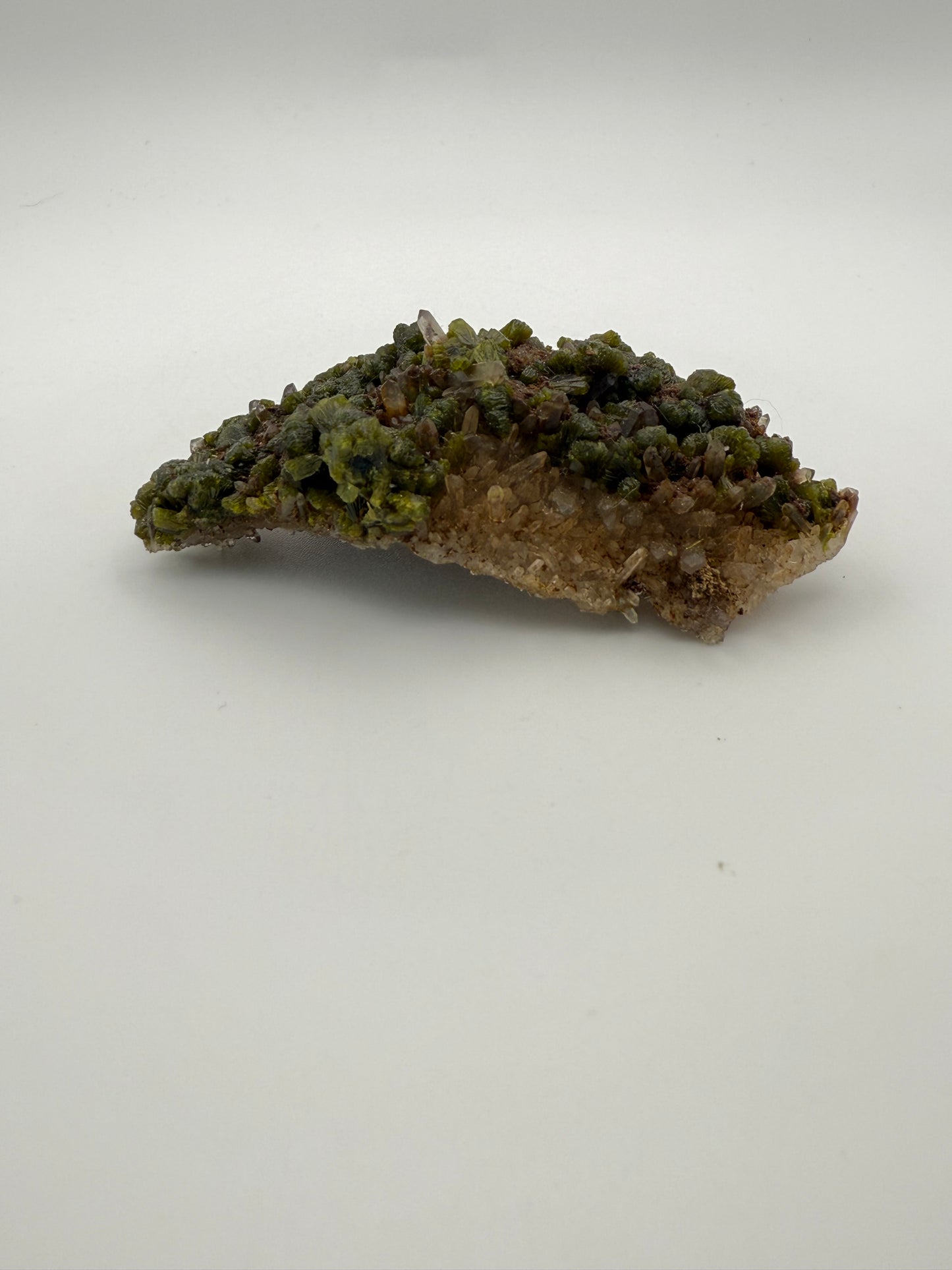 Epidote crystal cluster with good green color.