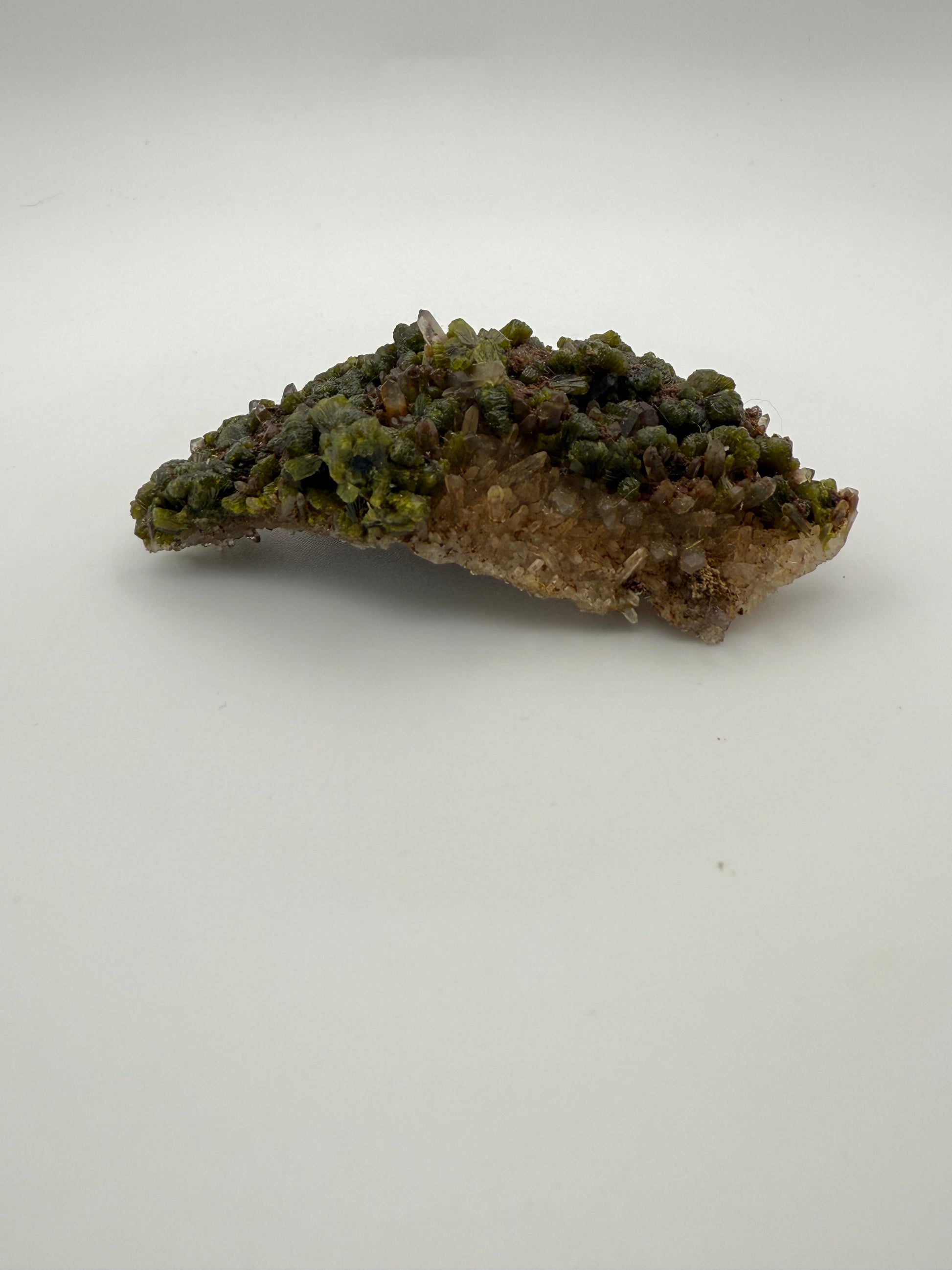 Epidote crystal cluster with good green color.