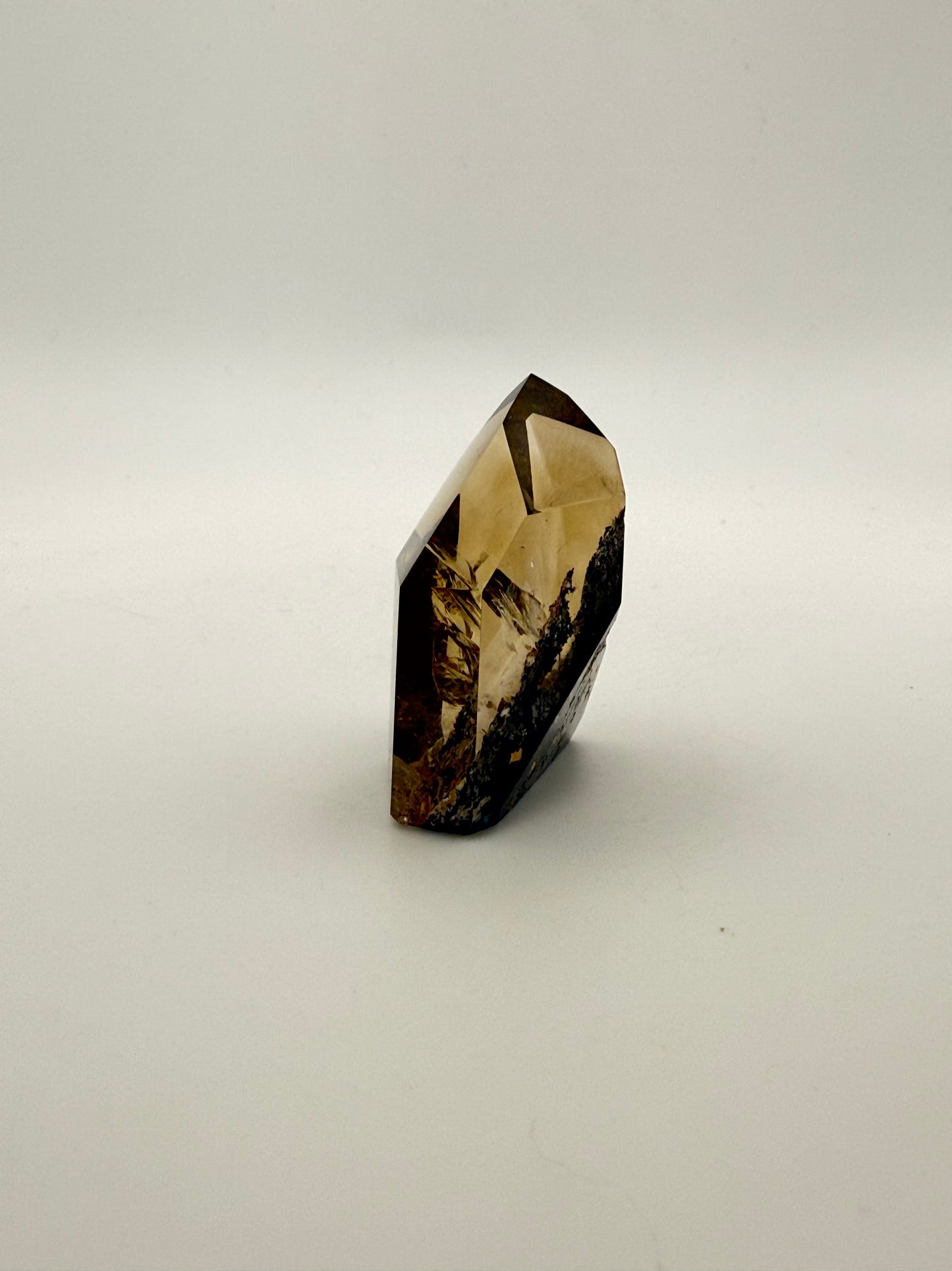 Polished natural citrine point.