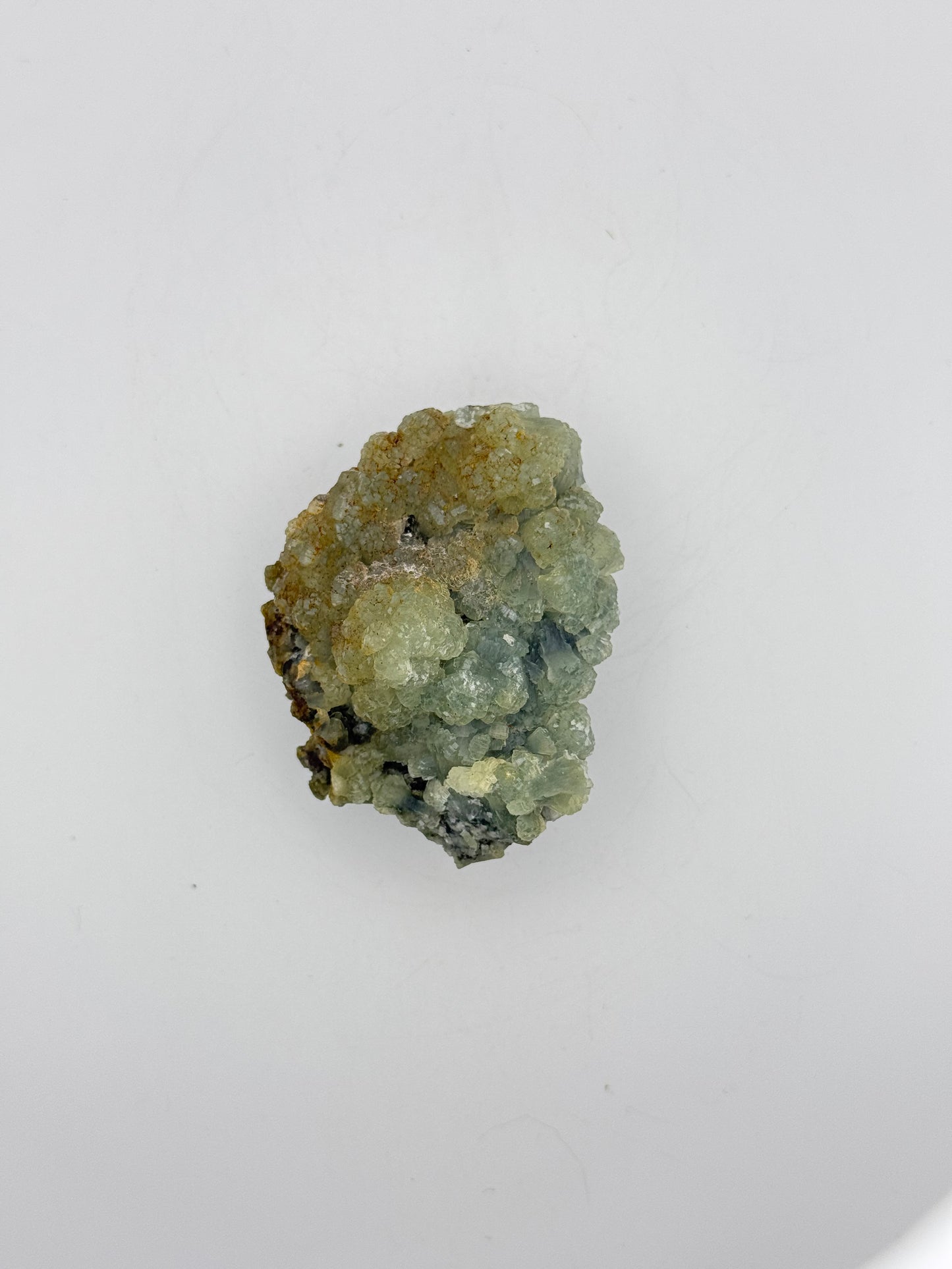 Raw Prehnite specimen with amazing green color.