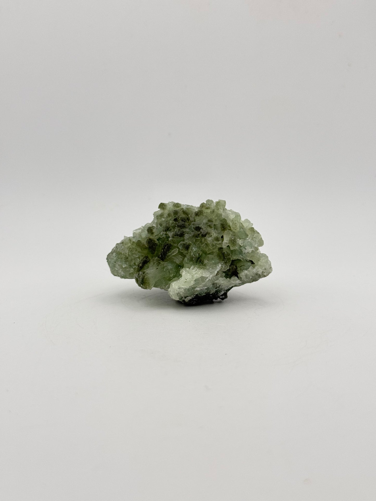 Raw Prehnite specimen with amazing green color.