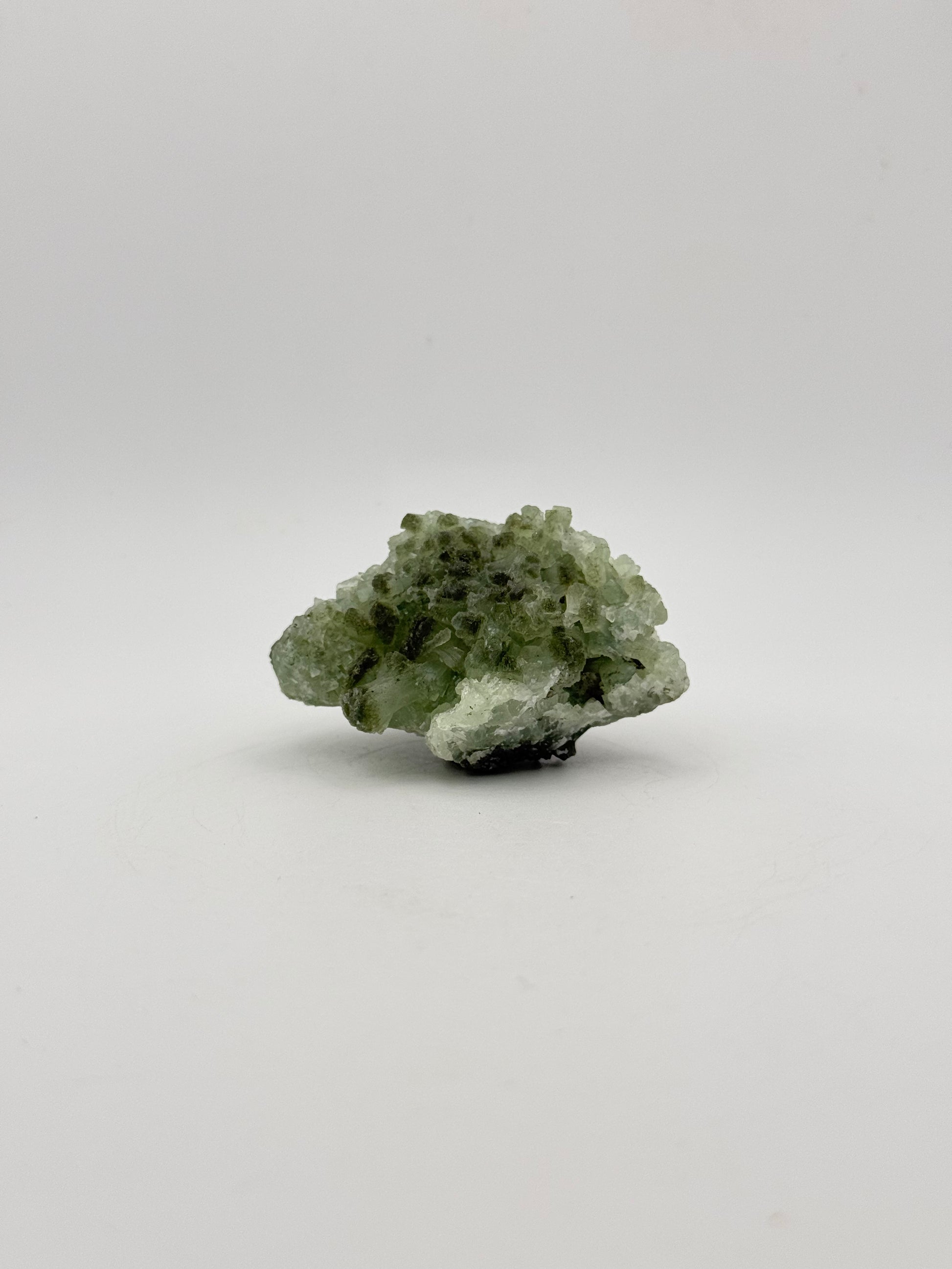 Raw Prehnite specimen with amazing green color.