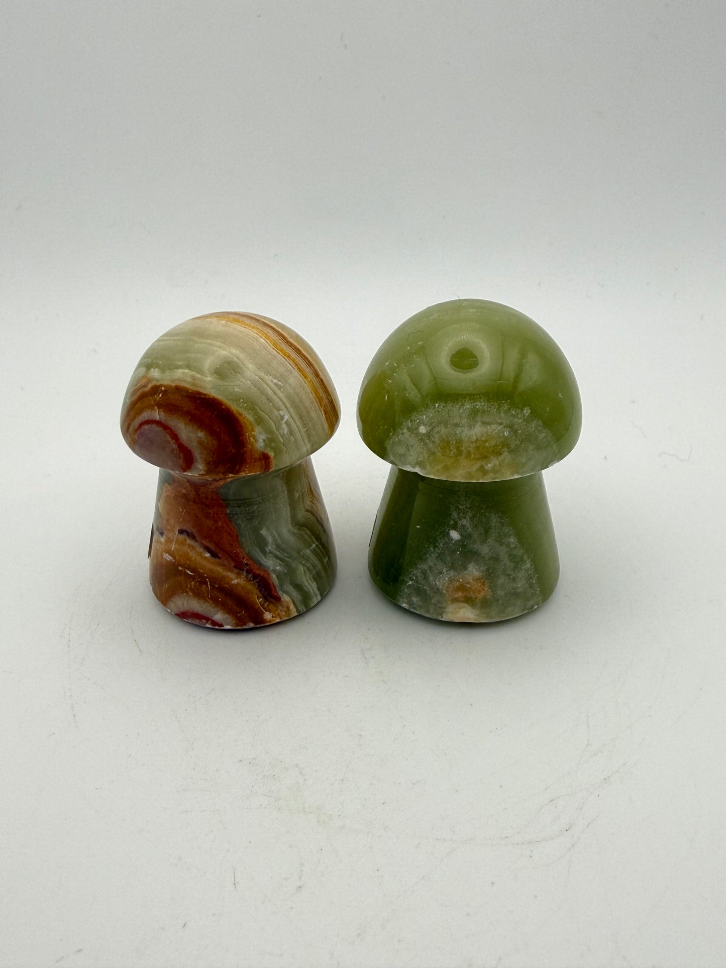 Two onyx mushroom-shaped stones.