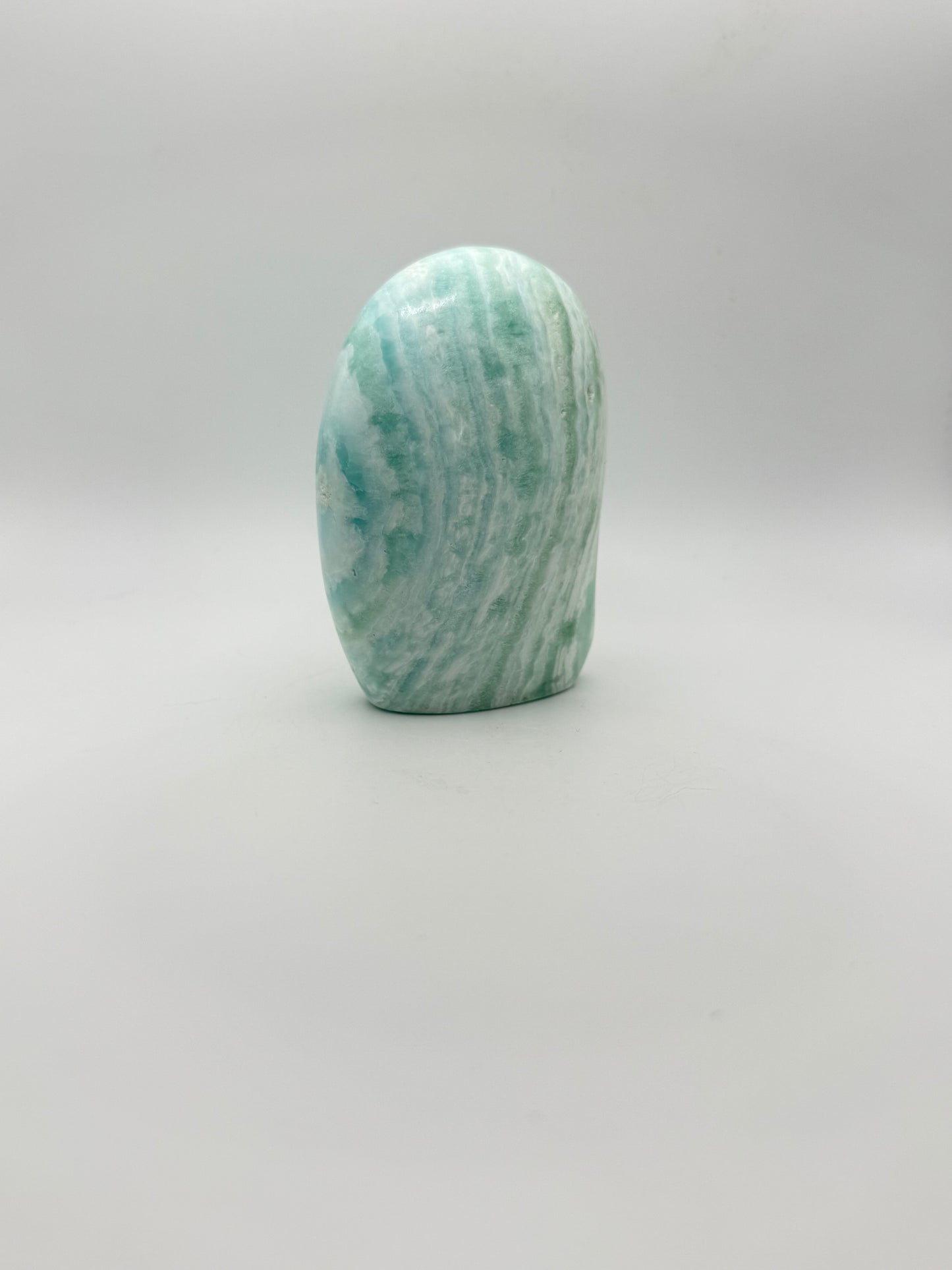 Caribbean calcite polished crystal free form in the shape of a dome.