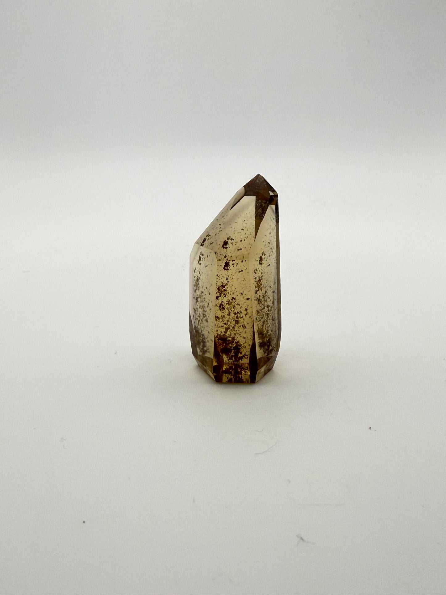 Polished natural citrine point.