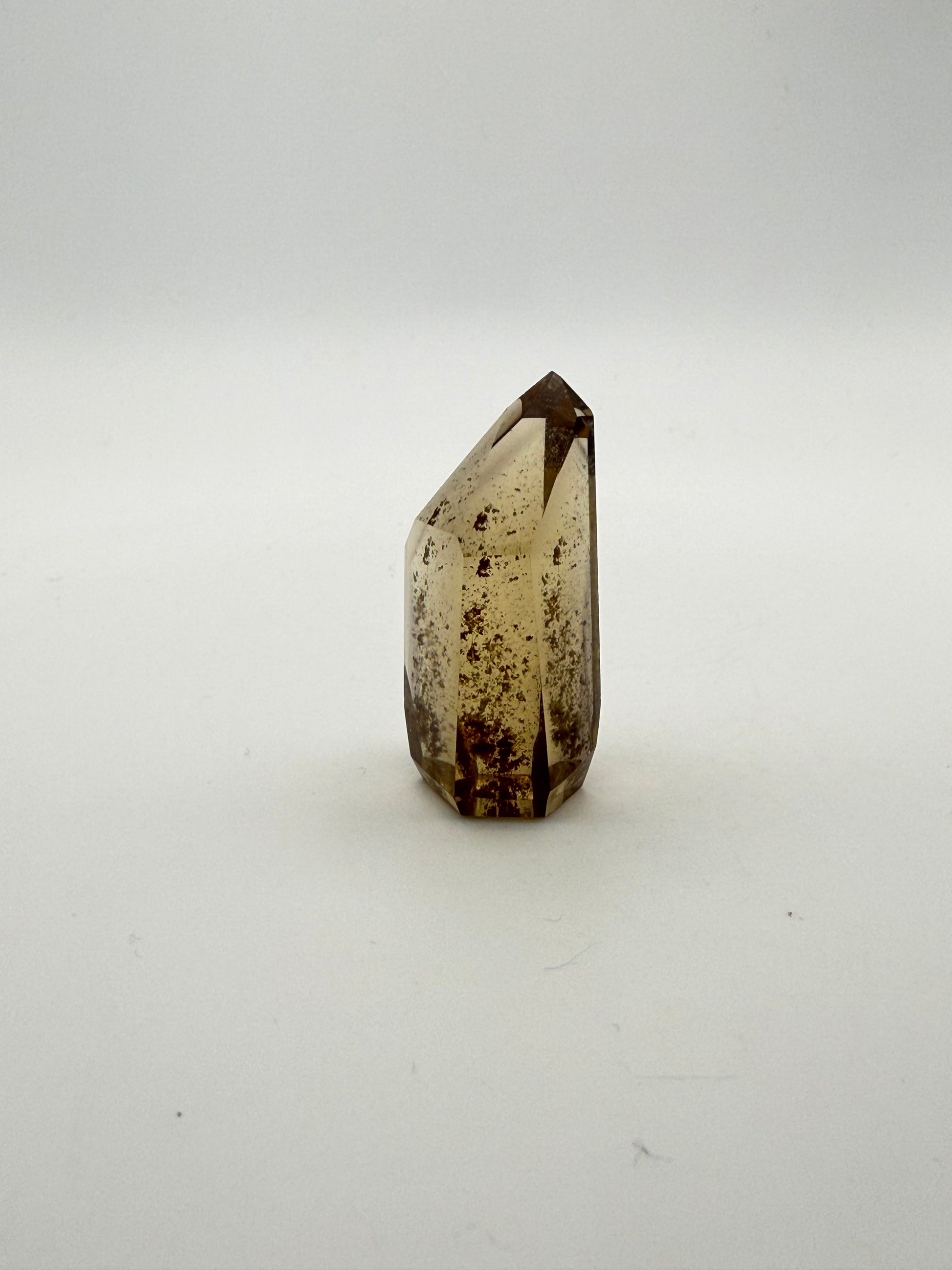 Polished natural citrine point.
