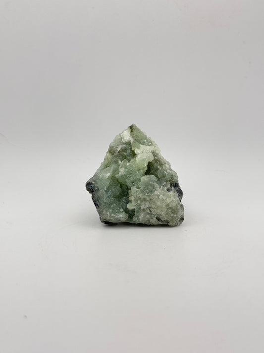Raw Prehnite specimen with amazing green color.
