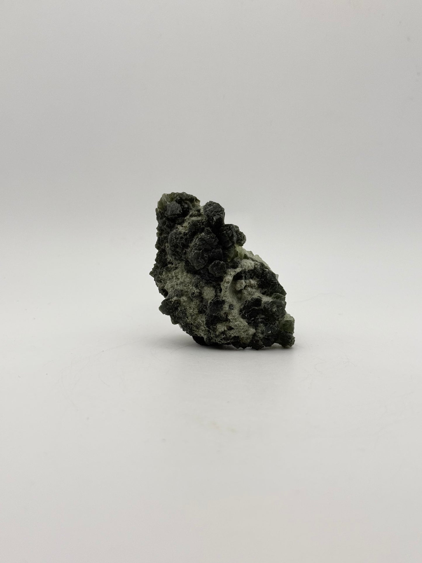 Raw prehnite specimen with amazing green color.