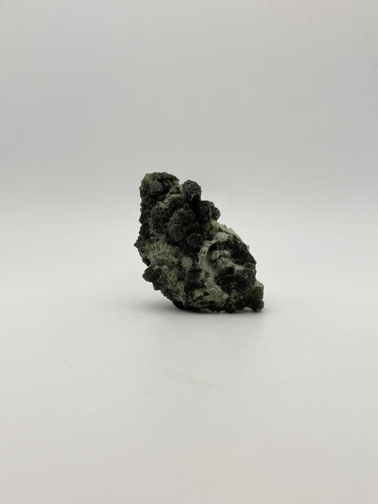 Raw prehnite specimen with amazing green color.