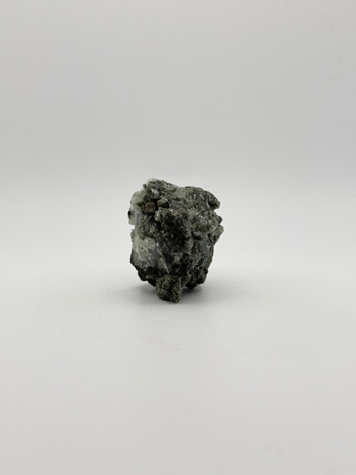 Raw prehnite specimen with amazing green color.