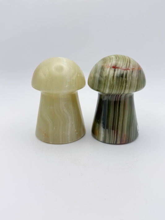 Two onyx mushroom-shaped stones.