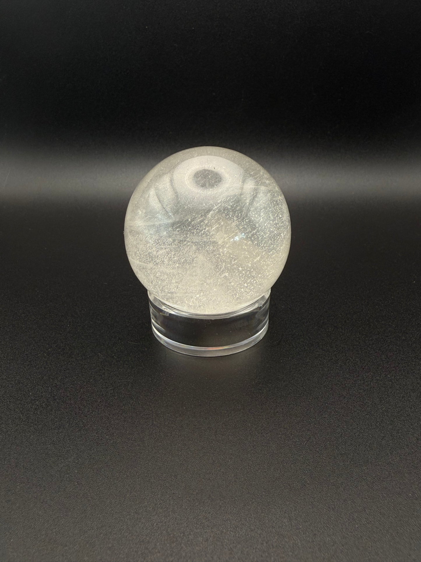 Clear quartz polished crystal sphere.