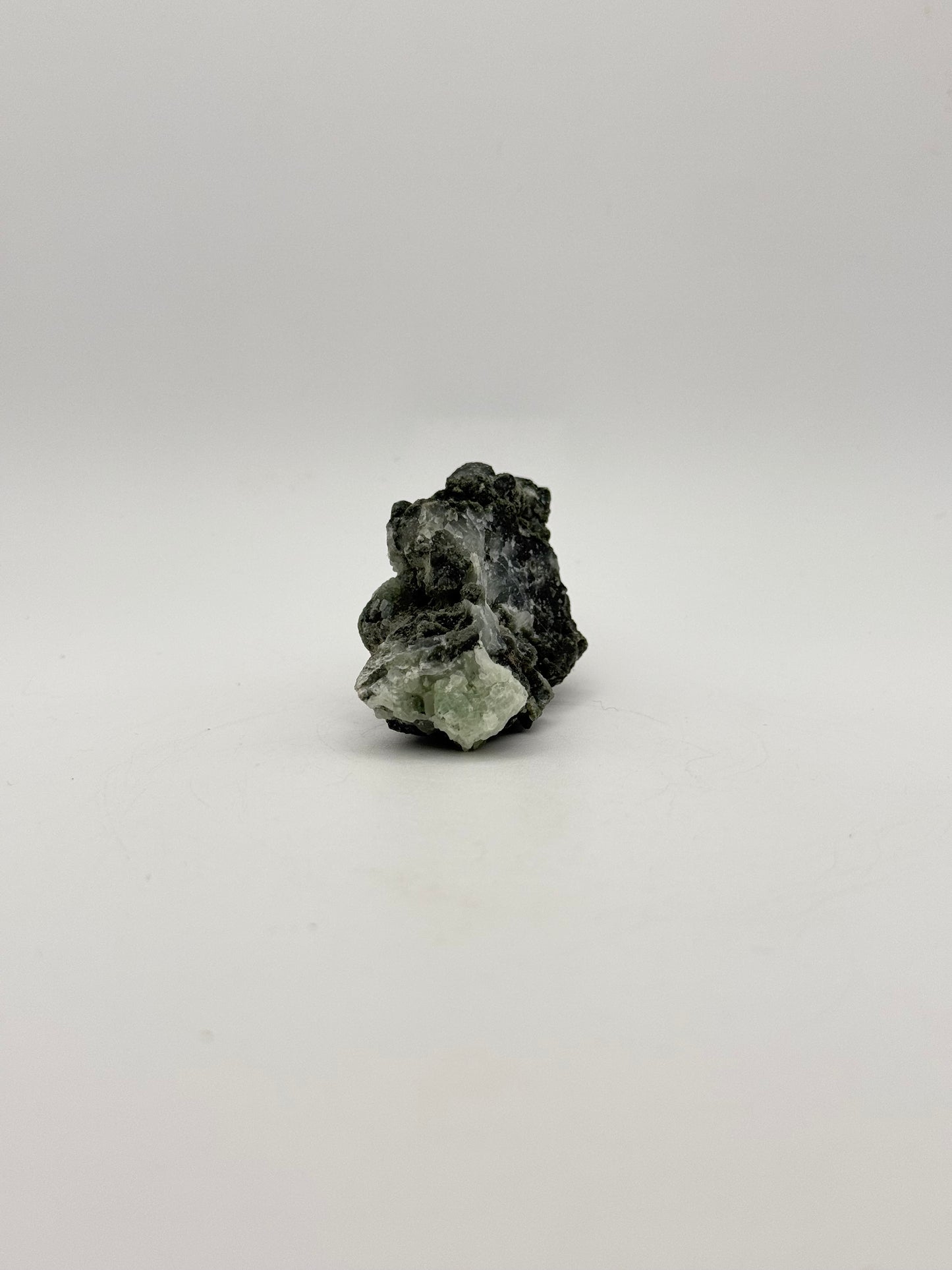 Raw prehnite specimen with amazing green color.