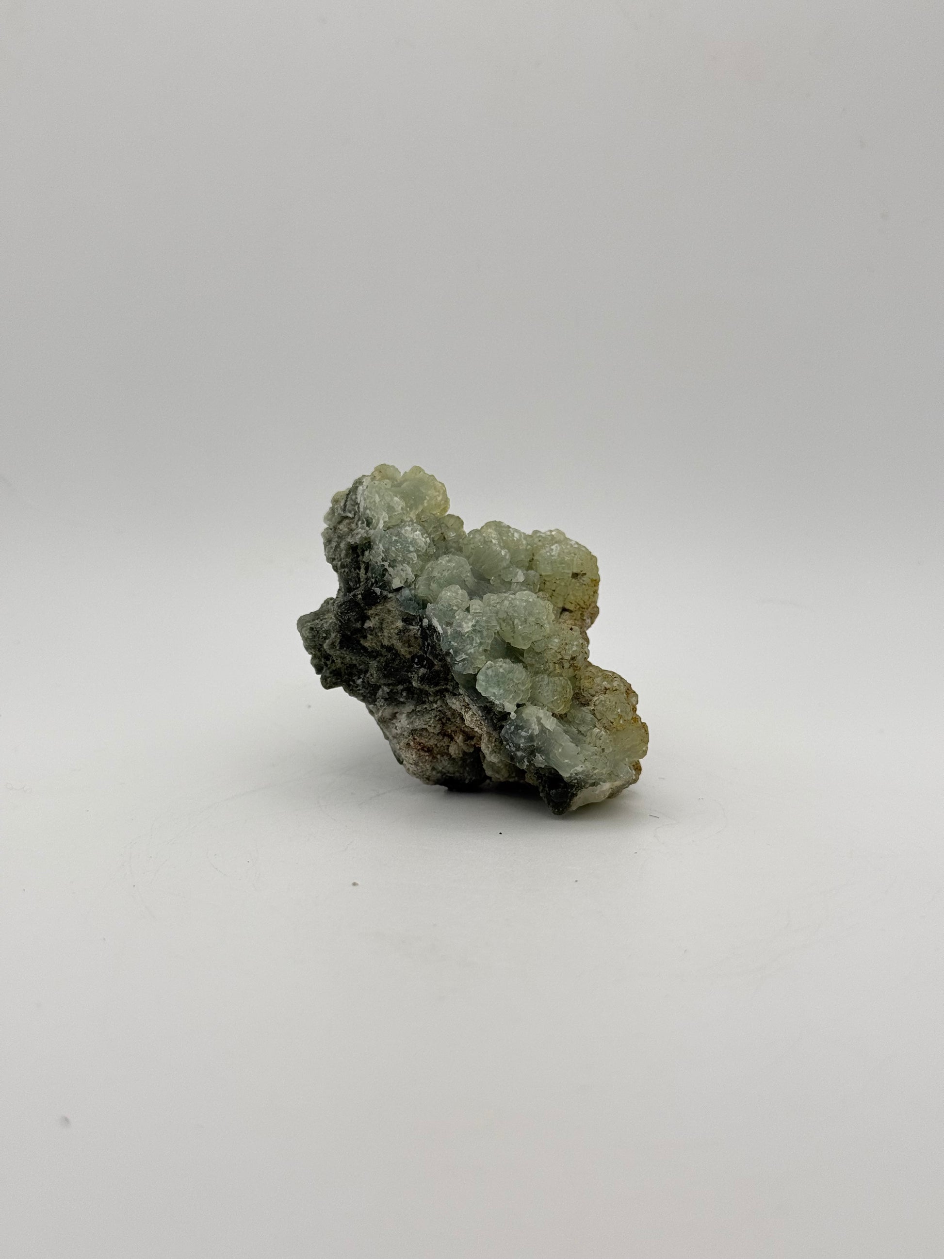 Raw Prehnite specimen with amazing green color.