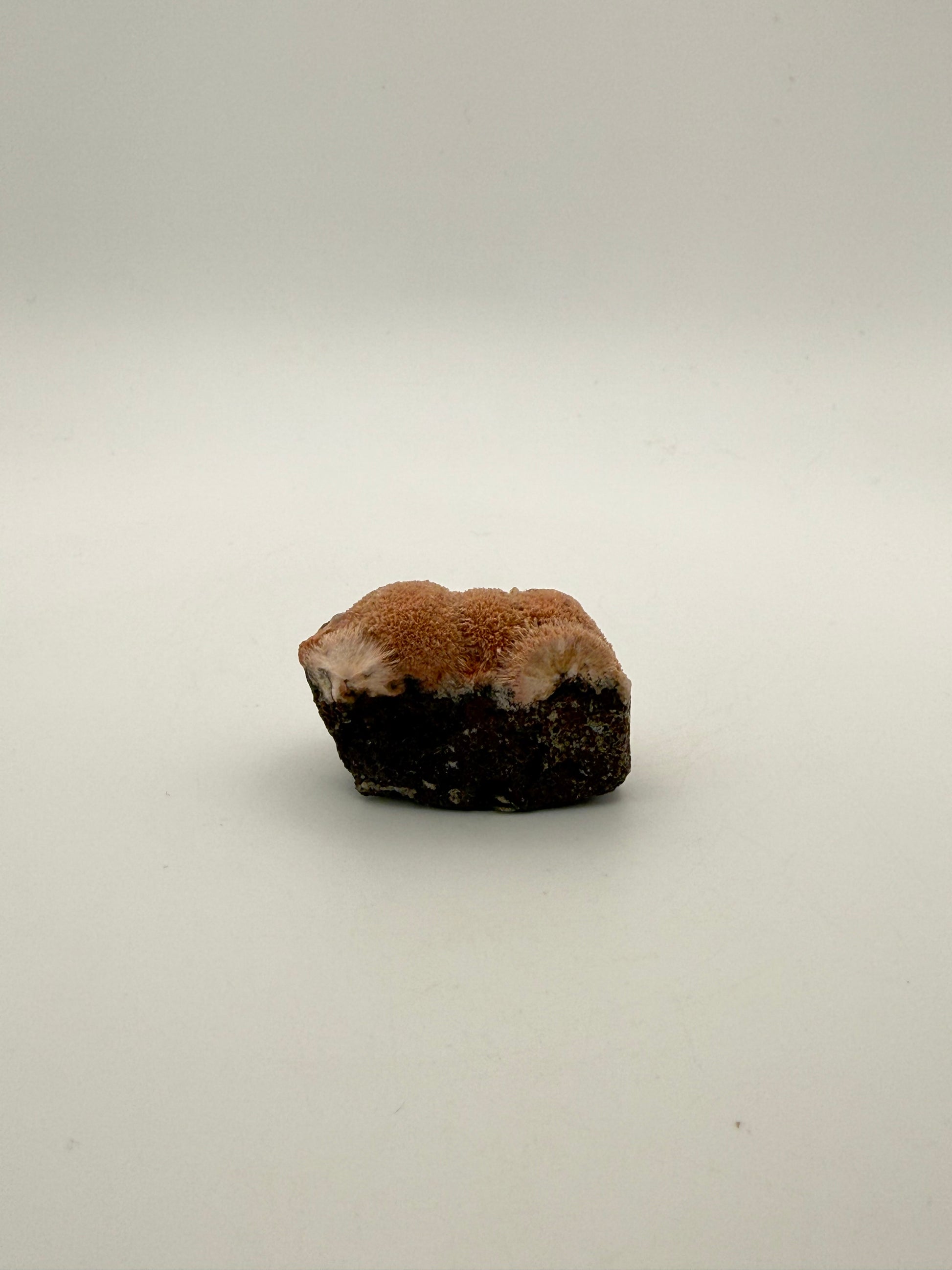 Raw Messolite crystal.