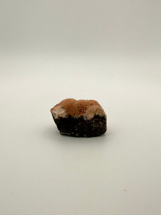 Raw Messolite crystal.