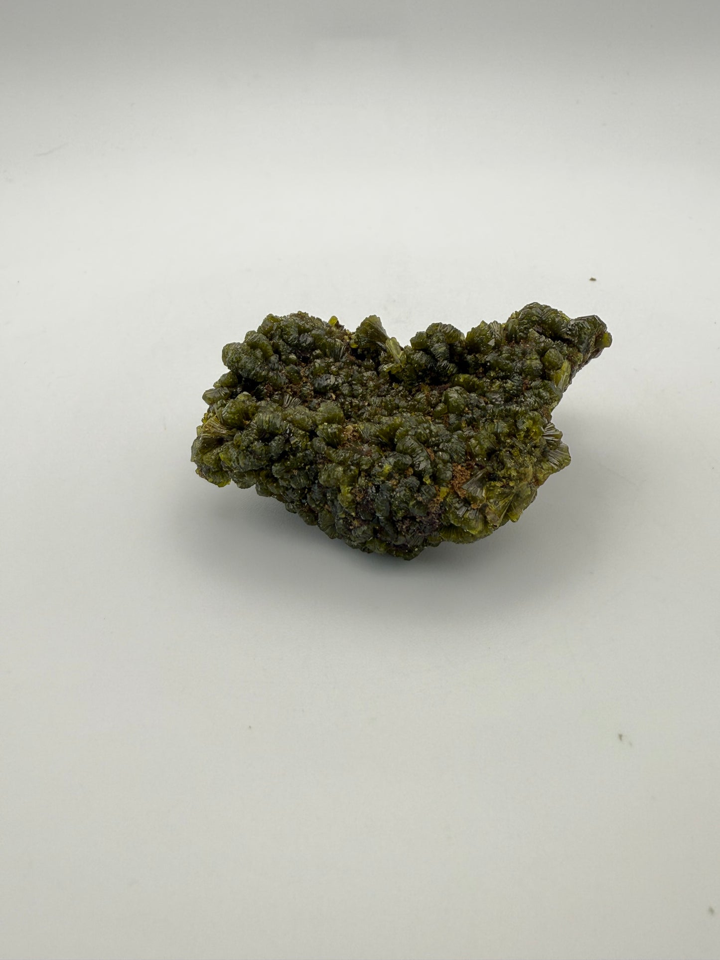 Epidote crystal cluster with good green color.