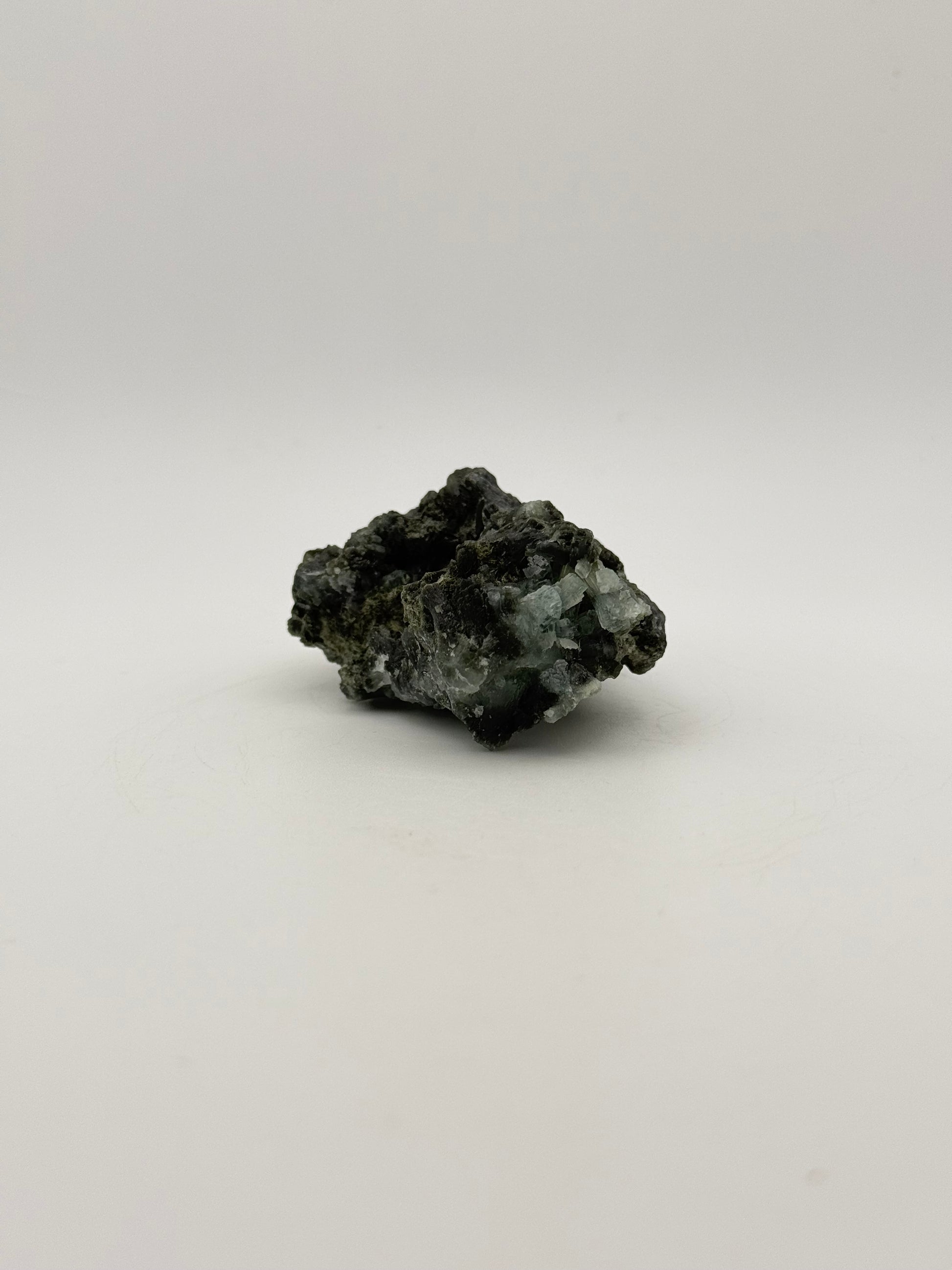 Raw Prehnite specimen with amazing green color.