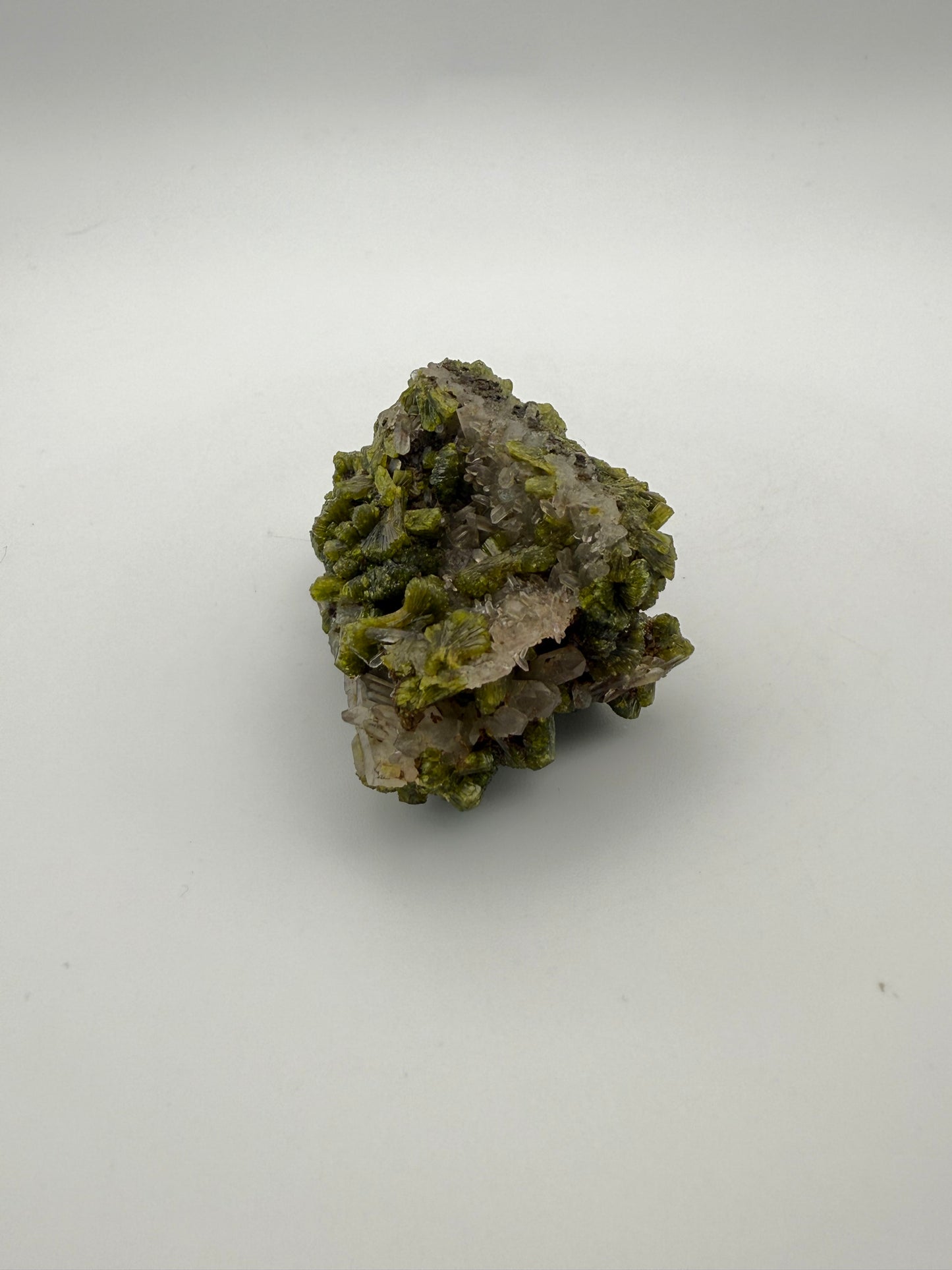 Epidote crystal cluster with good green color.