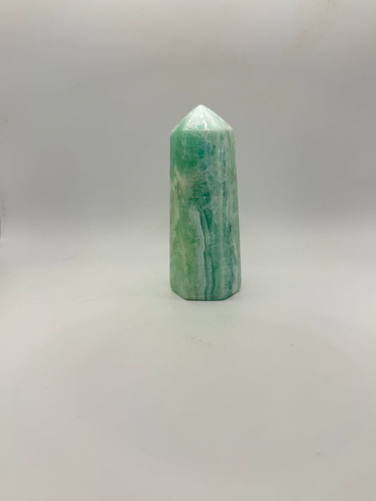 Caribbean Calcite polished six sided tower. A little over 4 inches tall.