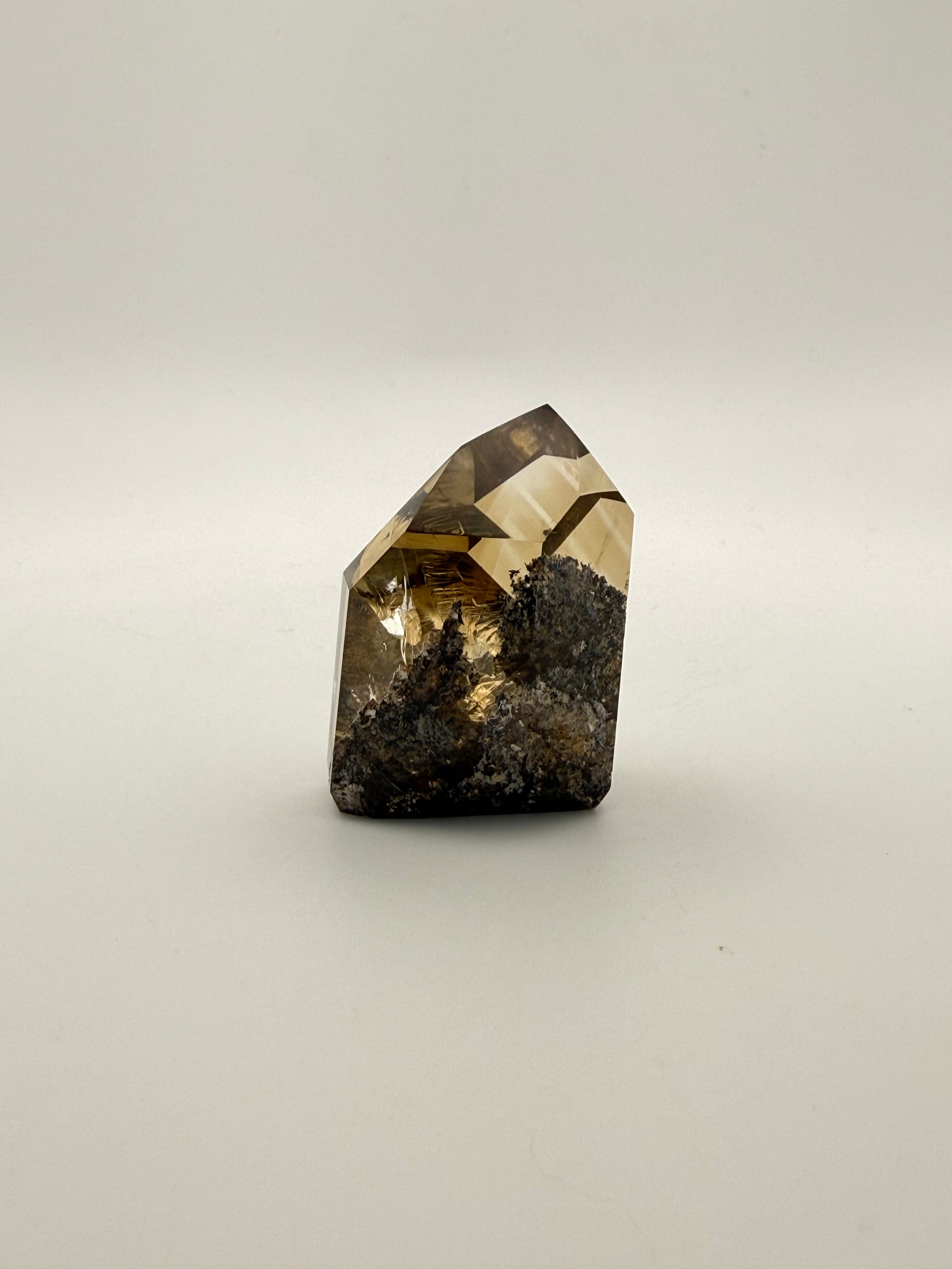 Polished natural citrine point.