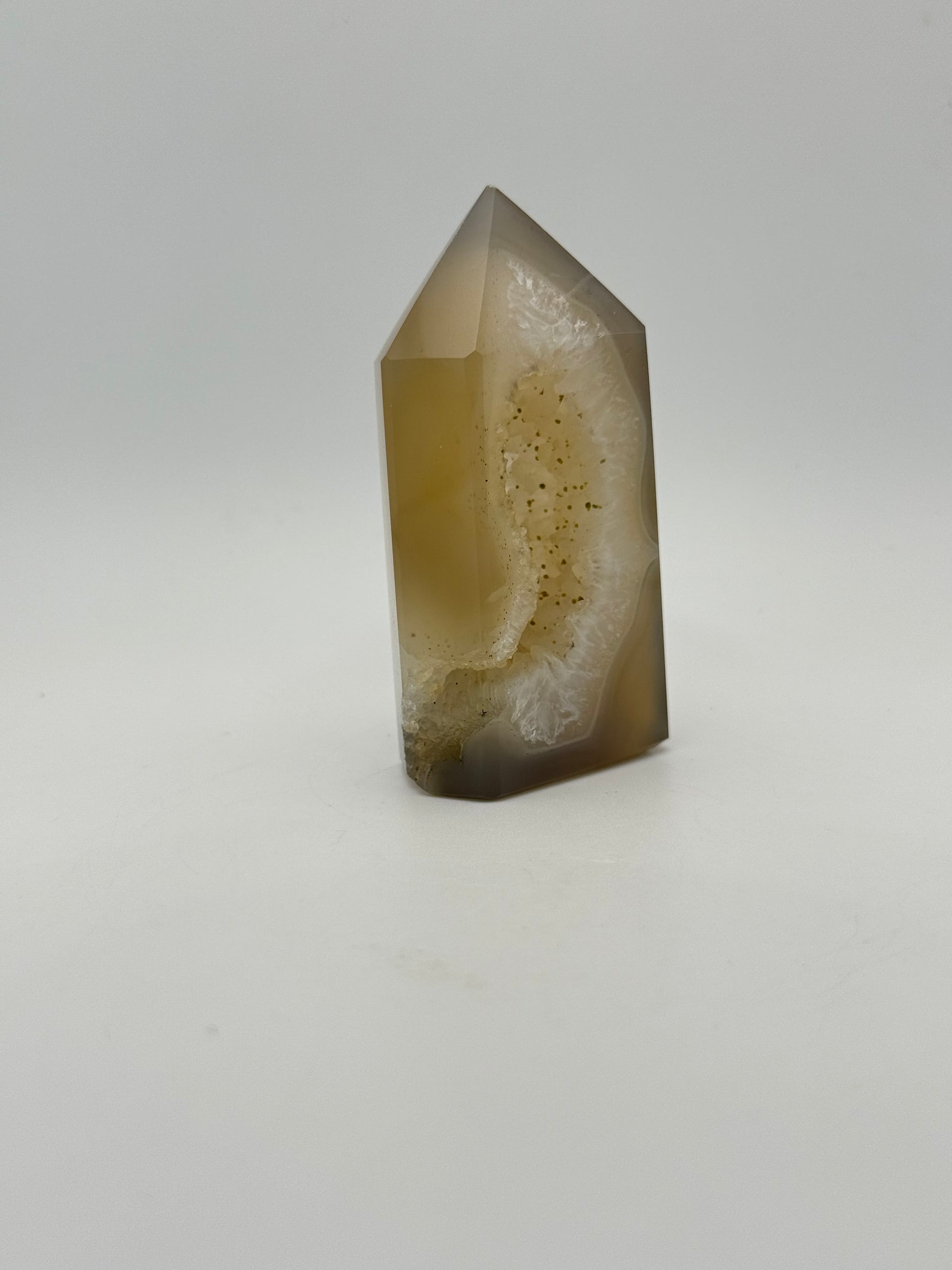 Polished druzy agate tower. About 3  inches tall.