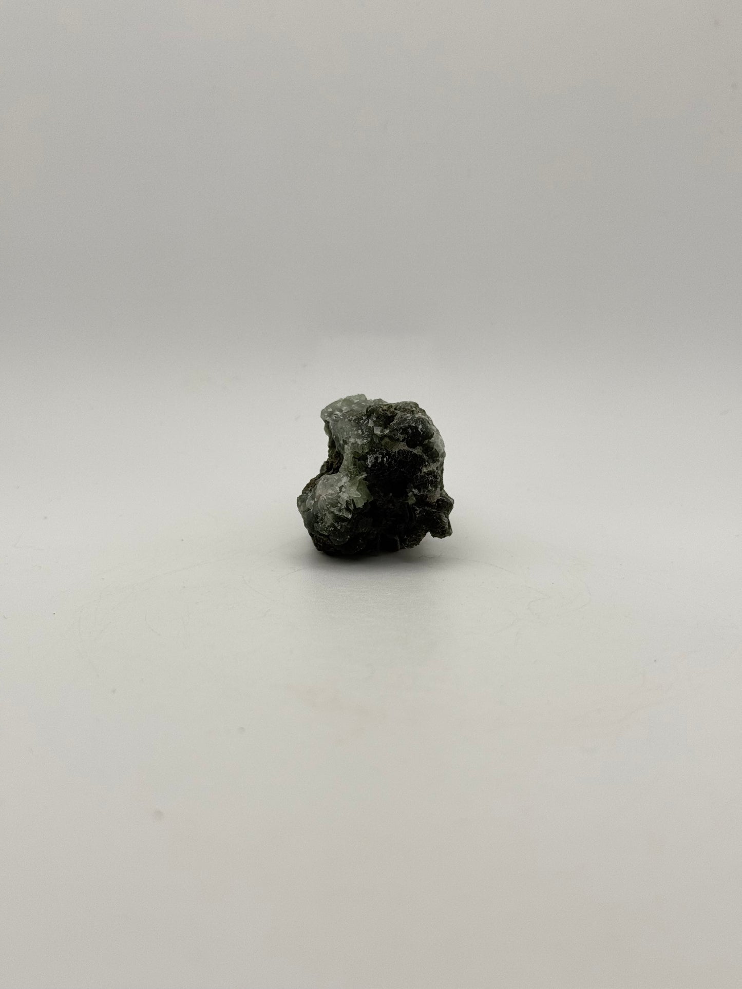 Raw prehnite specimen with amazing green color.