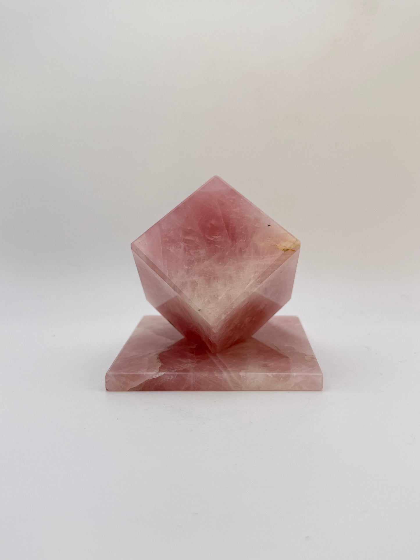 Polished rose quartz cut cube.