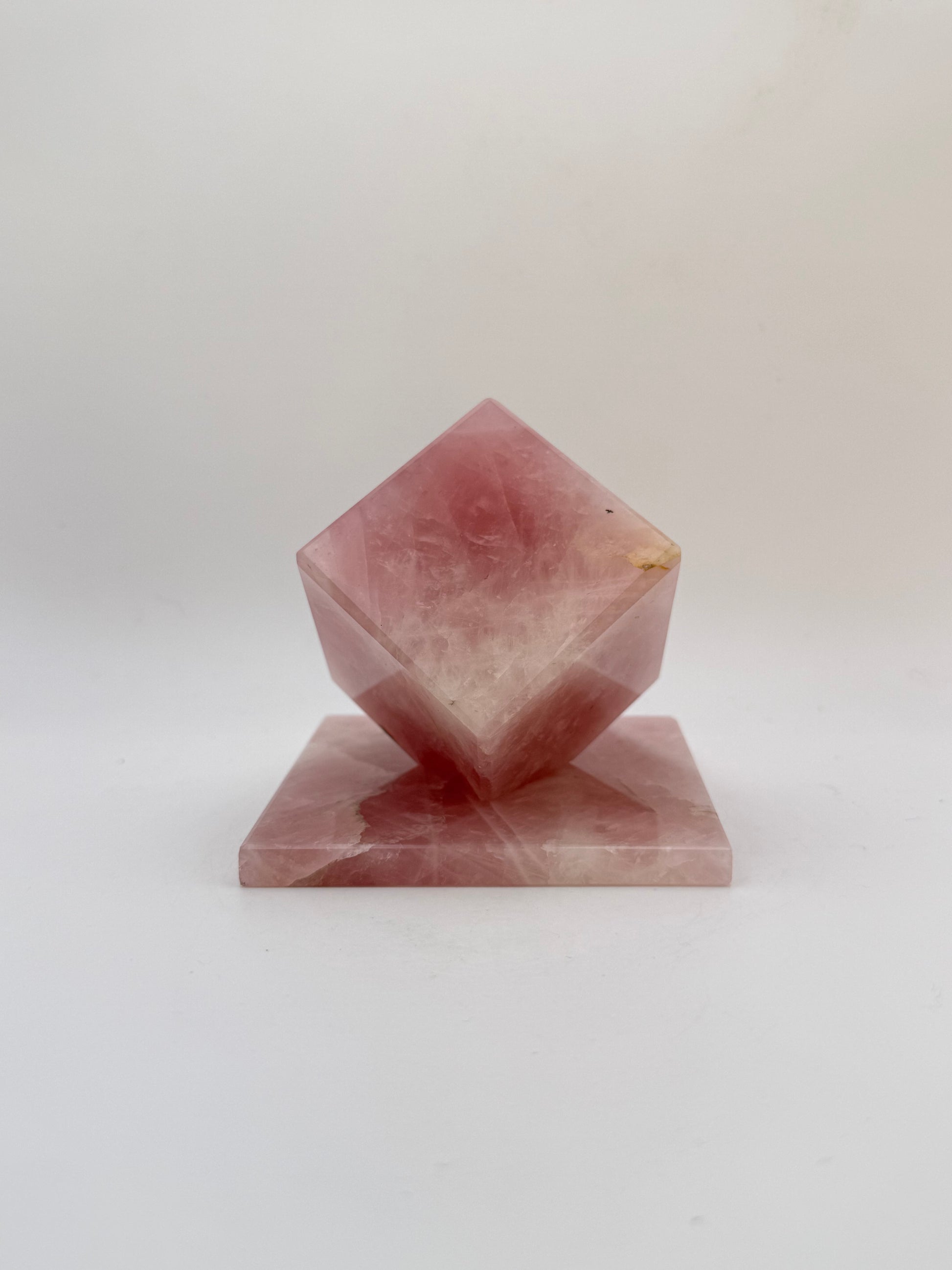 Polished rose quartz cut cube.