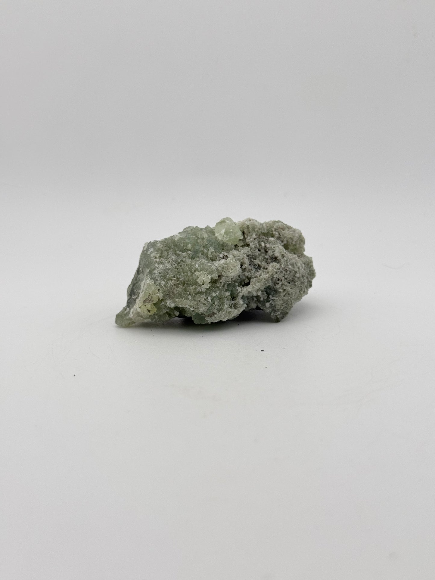 Raw Prehnite specimen with amazing green color.