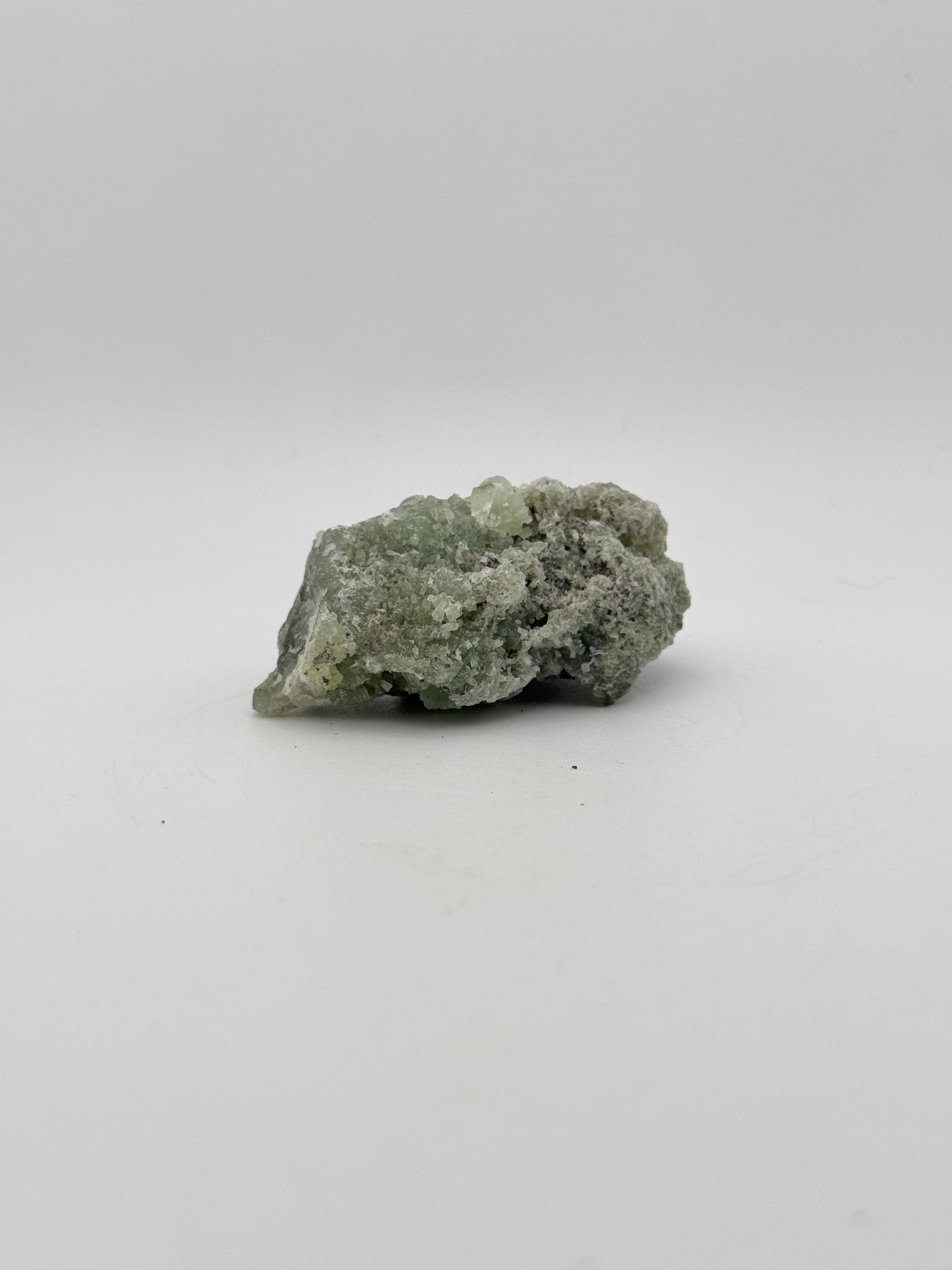 Raw Prehnite specimen with amazing green color.