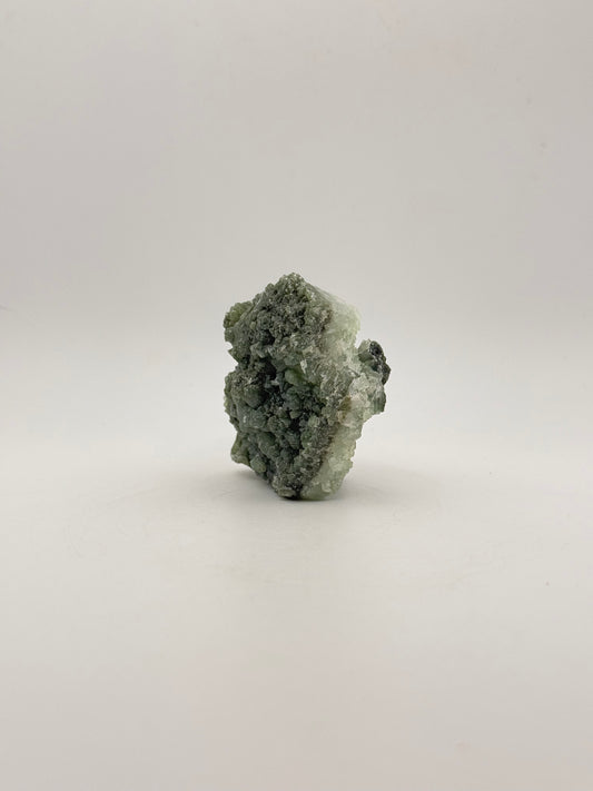 Raw Prehnite specimen with amazing green color.