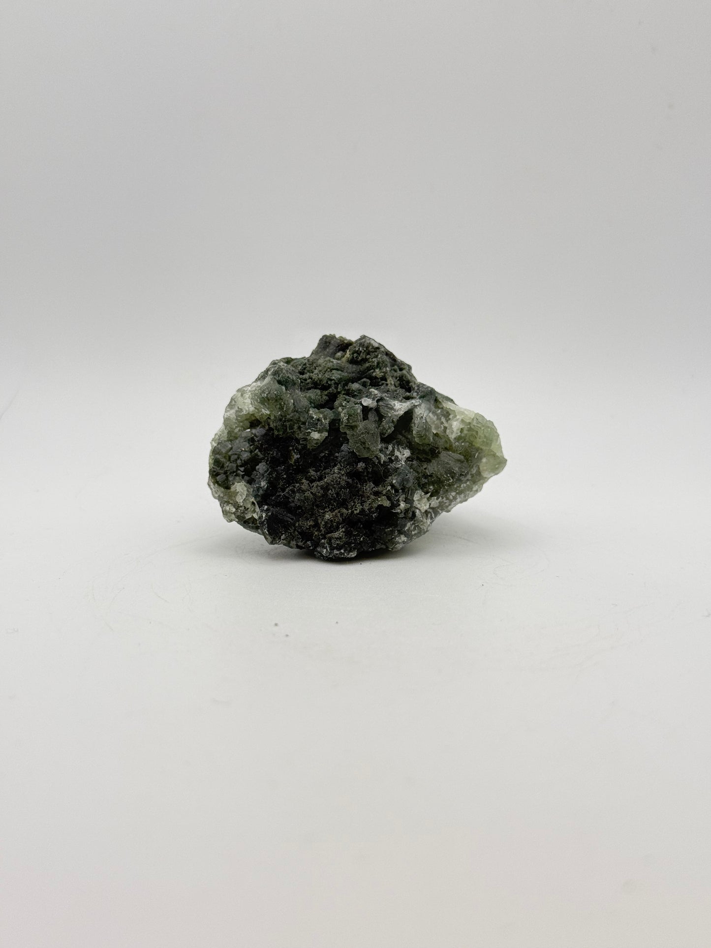 Raw Prehnite specimen with amazing green color.