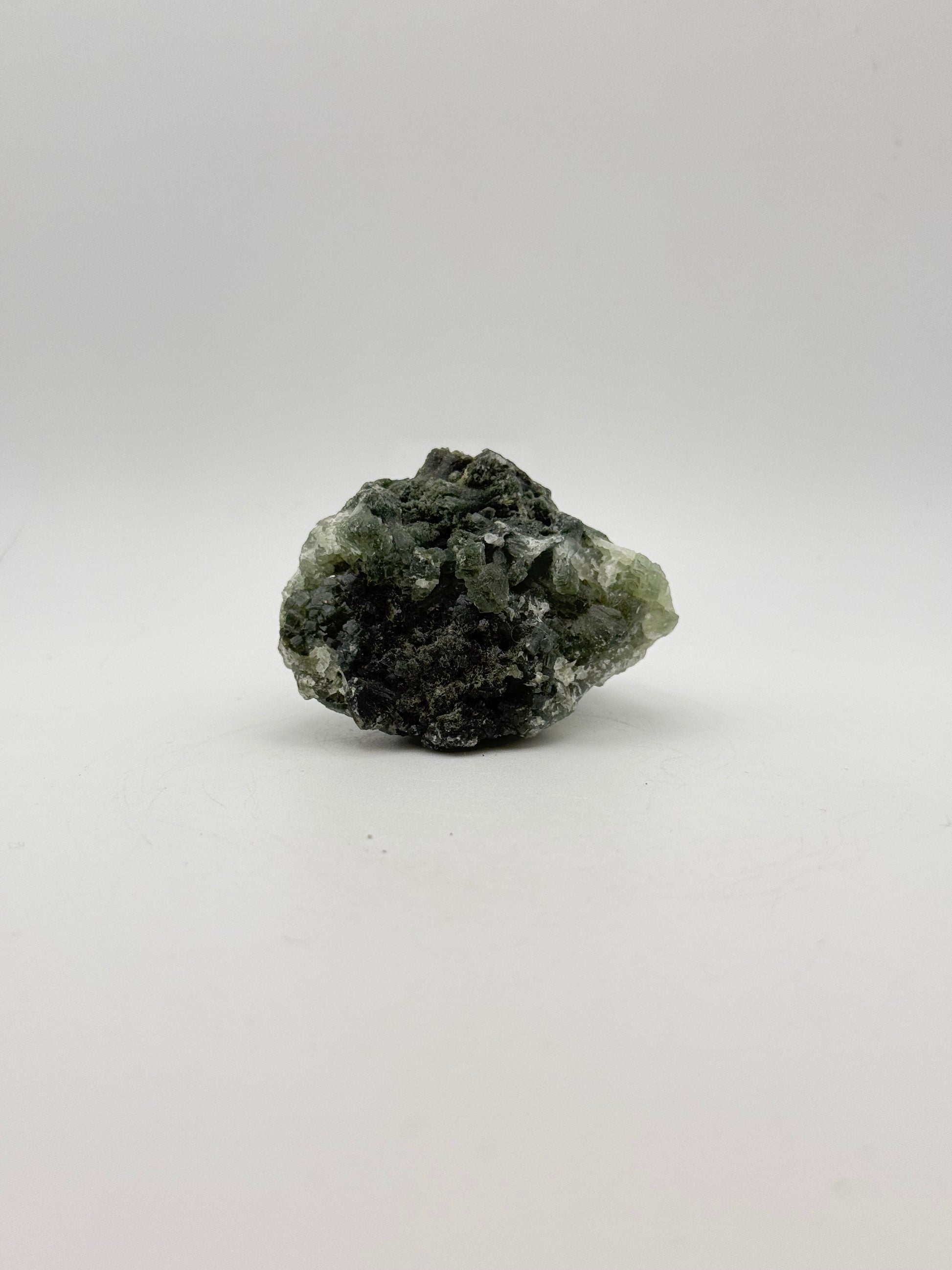 Raw Prehnite specimen with amazing green color.